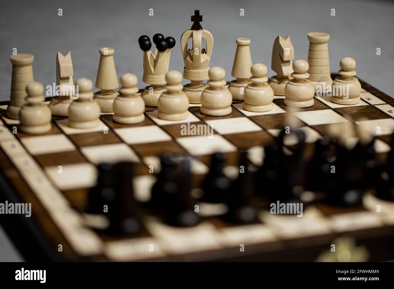 Wooden Chess Pieces On Board, Arranged In Incorrect Initial Position  Selective Focus. White King Is Not In His Cell. Small Mistake, Slight  Inaccuracy Leads To Big Consequences. First Chess Lesson Stock Photo