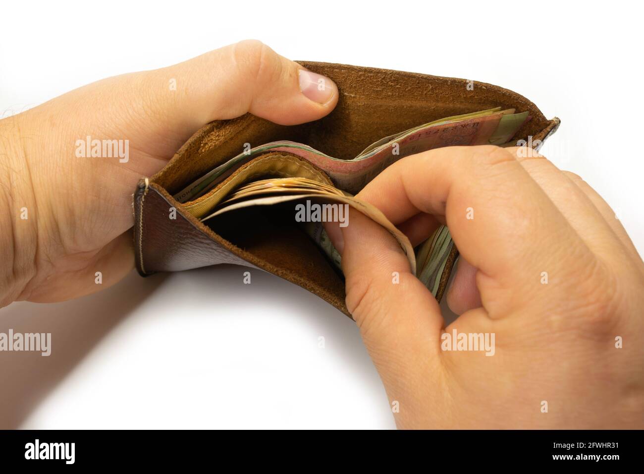 hand counting money in wallet on white background Stock Photo - Alamy