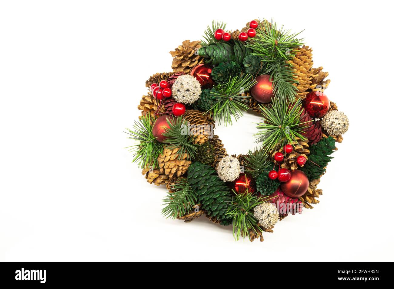 Christmas wreath of fir branches and cones on a white background Stock ...
