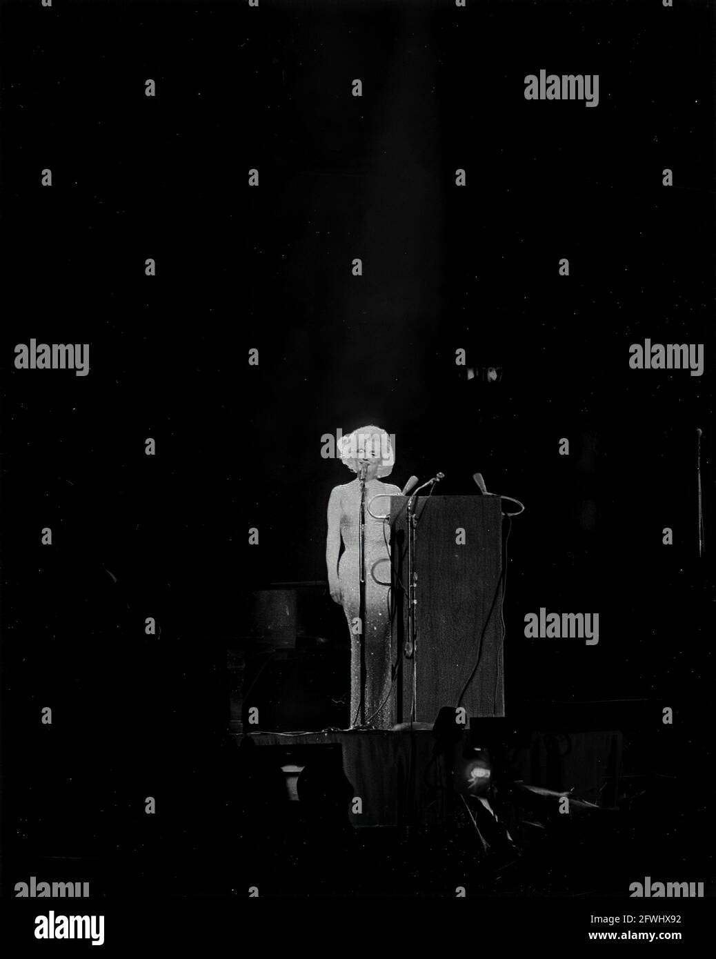 19 May 1962 Actress Marilyn Monroe sings Happy Birthday to President John F. Kennedy at his birthday salute at New York City's Madison Square Garden [White spotting throughout negative.]  Please credit "Cecil Stoughton. White House Photographs. Stock Photo