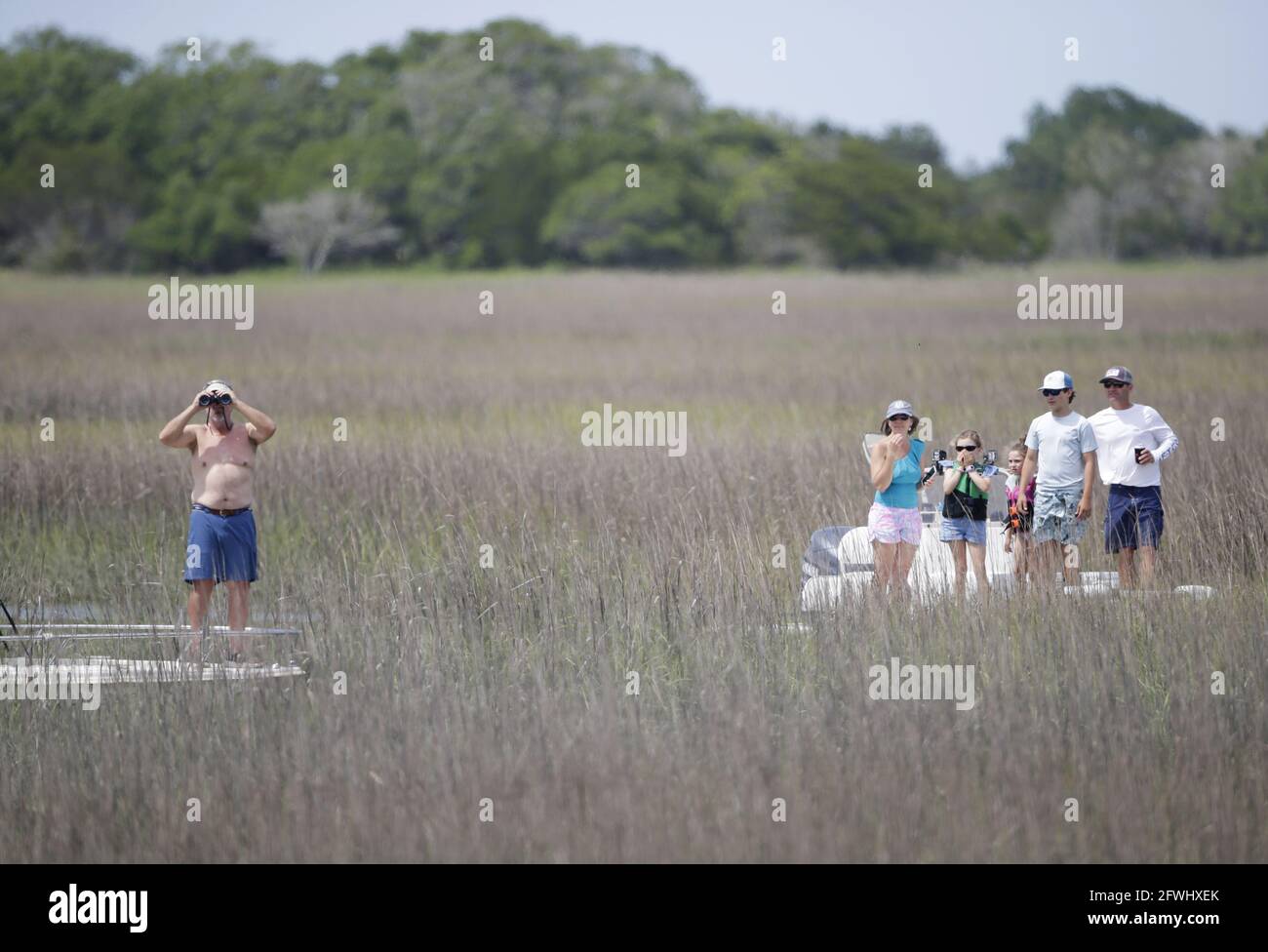 Kiawah Island, United States. 22nd May, 2021. Spectators watch Phil Mickelson's group from boats floating in the marsh among the spartina grass in the third round of the 103rd PGA Championship at Kiawah Island Golf Resort Ocean Course on Kiawah Island, South Carolina on Saturday, May 22, 2021. Photo by John Angelillo/UPI Credit: UPI/Alamy Live News Stock Photo