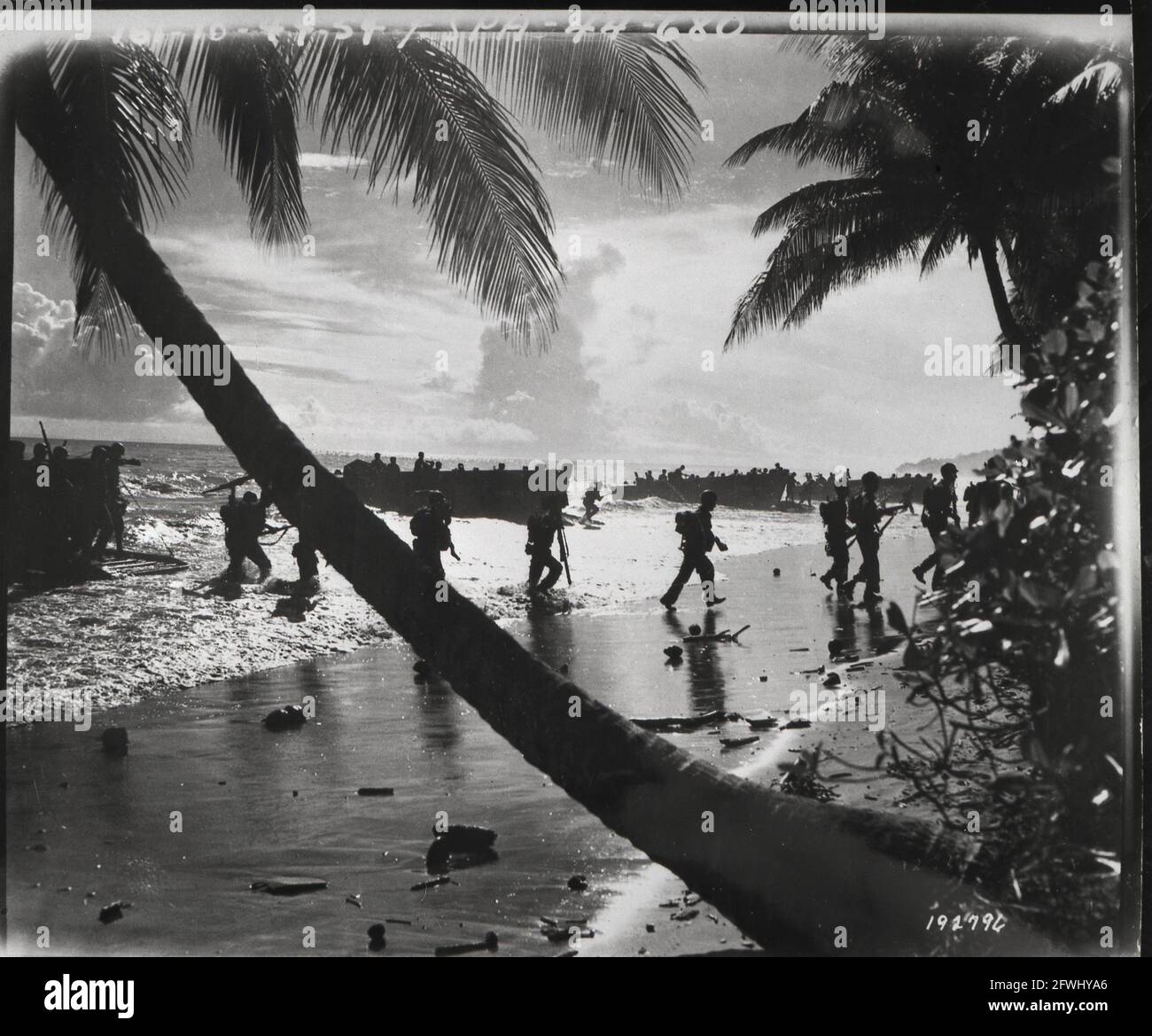 American troops of the 160th Infantry Regiment rush ashore from a landing boat during amphibious training here. Guadalcanal Solomon Islands South Pacific1944 March 1st Stock Photo