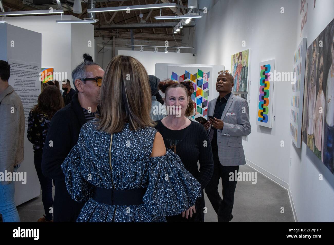 Patrons at Mash art gallery opening of the show Psych-O-Delic. 1st show after 2021 covid 19 restrictions were lifted in Los Angeles. Stock Photo