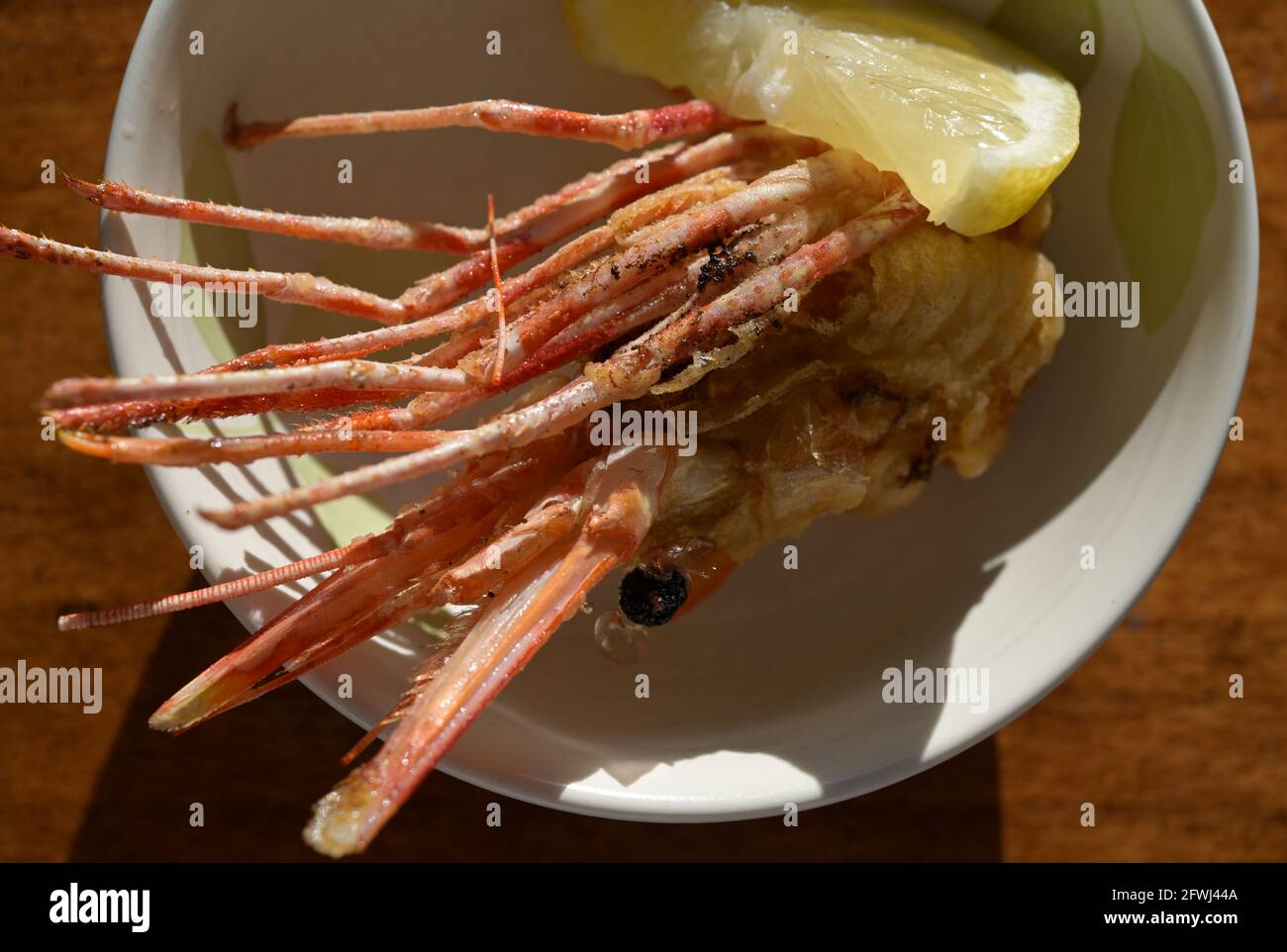 Japanese fried Shrimp head (Ebi) with a slice of lemon, Silicon Valley