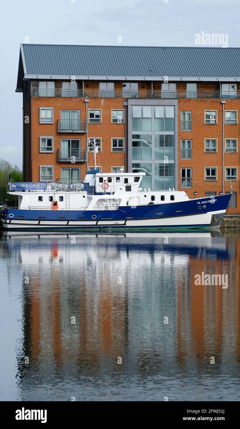 Sea Cadets training ship moored in the main basin of Gloucester Docks Stock Photo