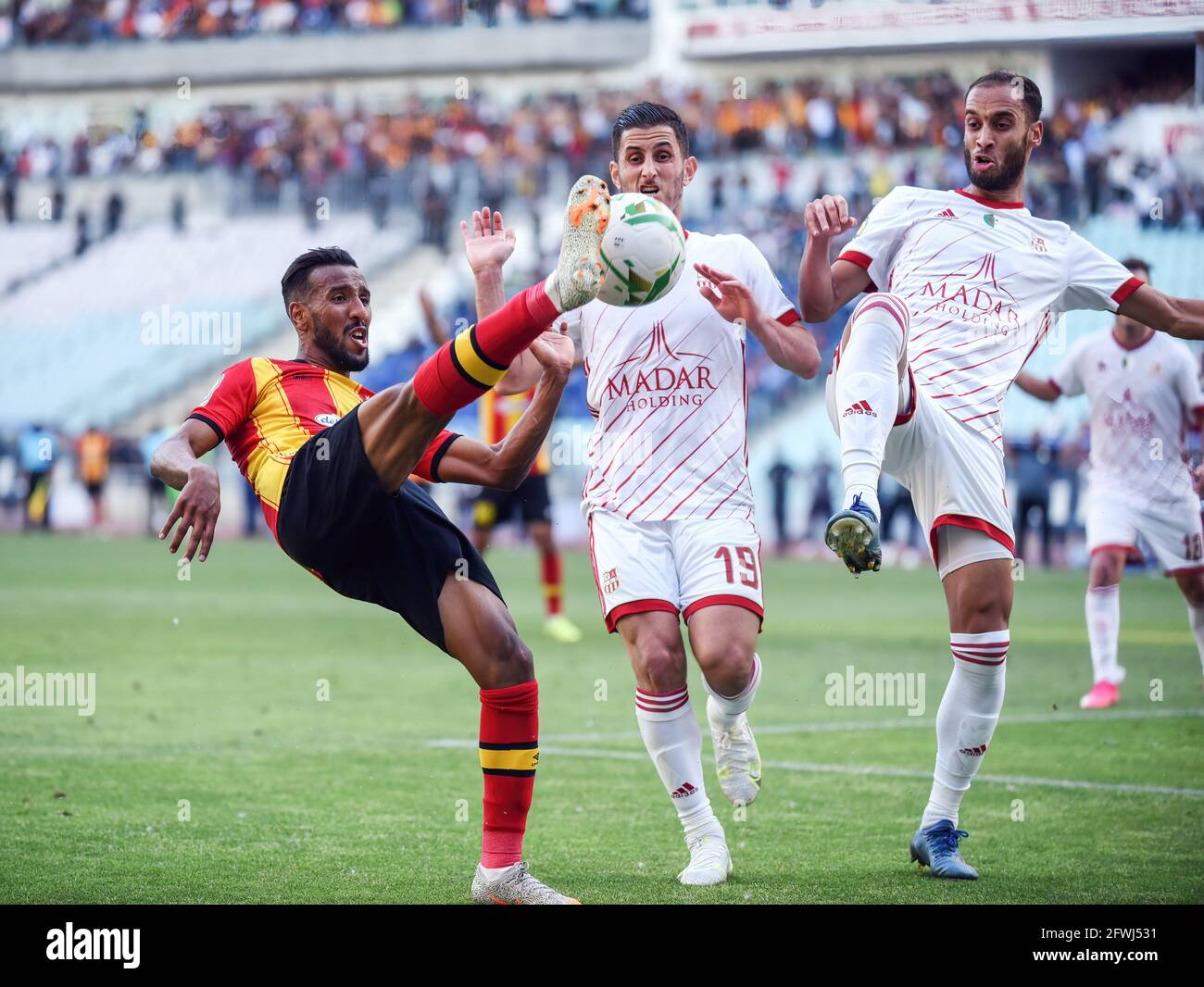 Tunis, Tunisia. 22nd May, 2021. Esperance player Hamdou El Houni and CR Belouizdad, Chamseddine Nessakh and Adel djarrar in action during the African Champions League quarter-final match between Esperance Sportive de Tunis (EST) and CR Belouizdad from Algeria at Rades stadiums. (Final score; Esperance sportive 2: 0 CR Belouizdad from Algeria) (Photo by Jdidi Wassim/SOPA Images/Sipa USA) Credit: Sipa USA/Alamy Live News Stock Photo