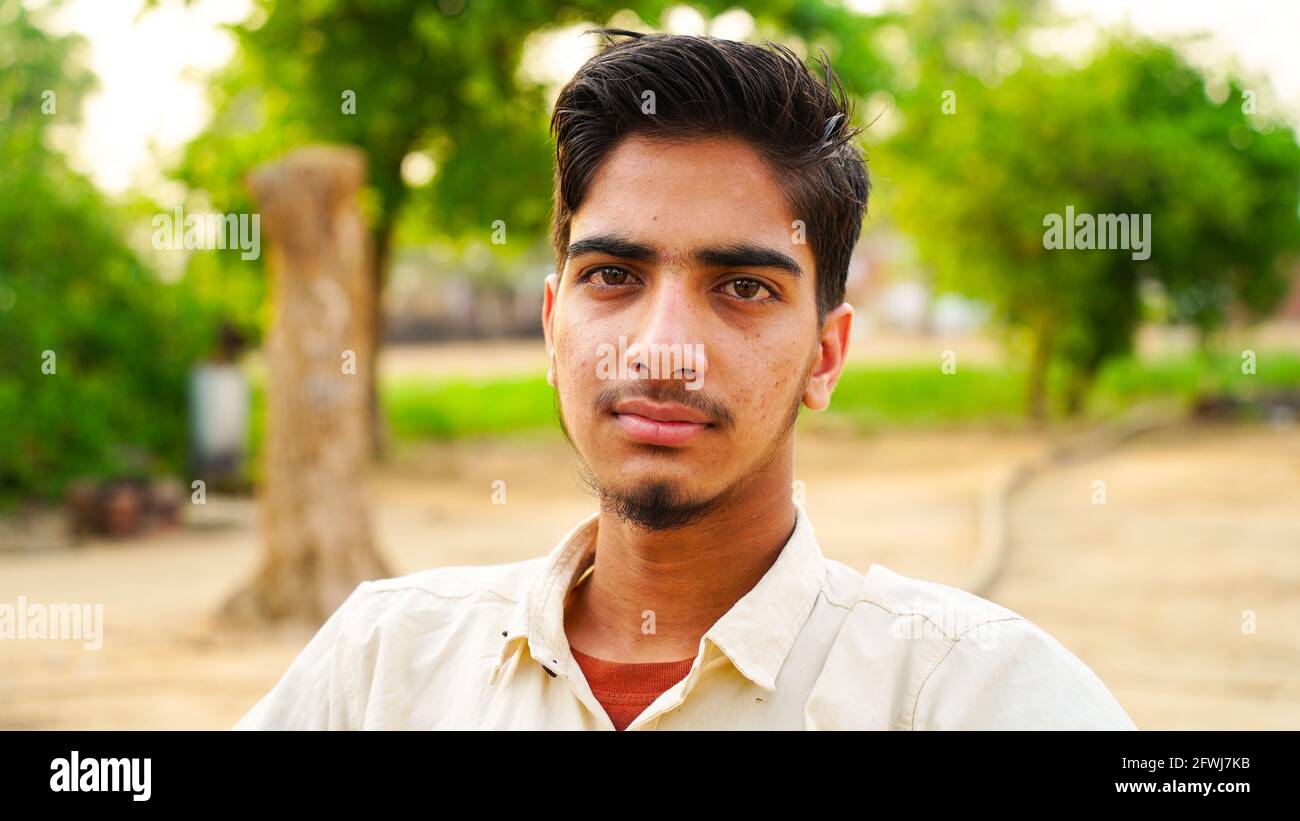 Portrait young indian man face hi-res stock photography and images - Alamy