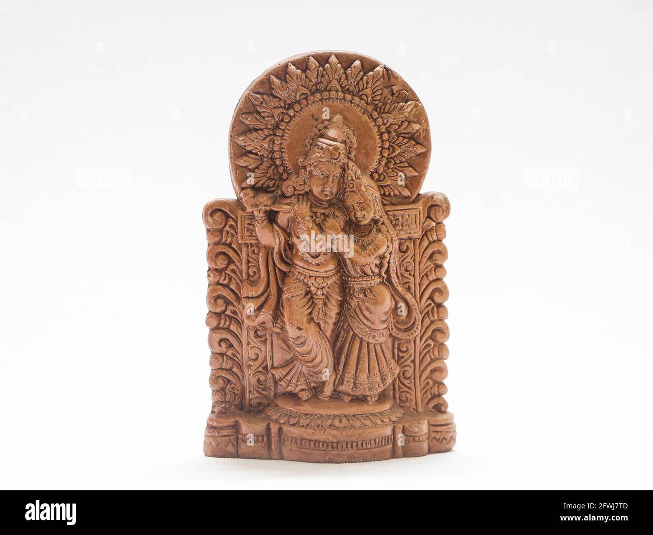 hindu god lord krishna and radha traditional antique brown wooden sculpture Stock Photo