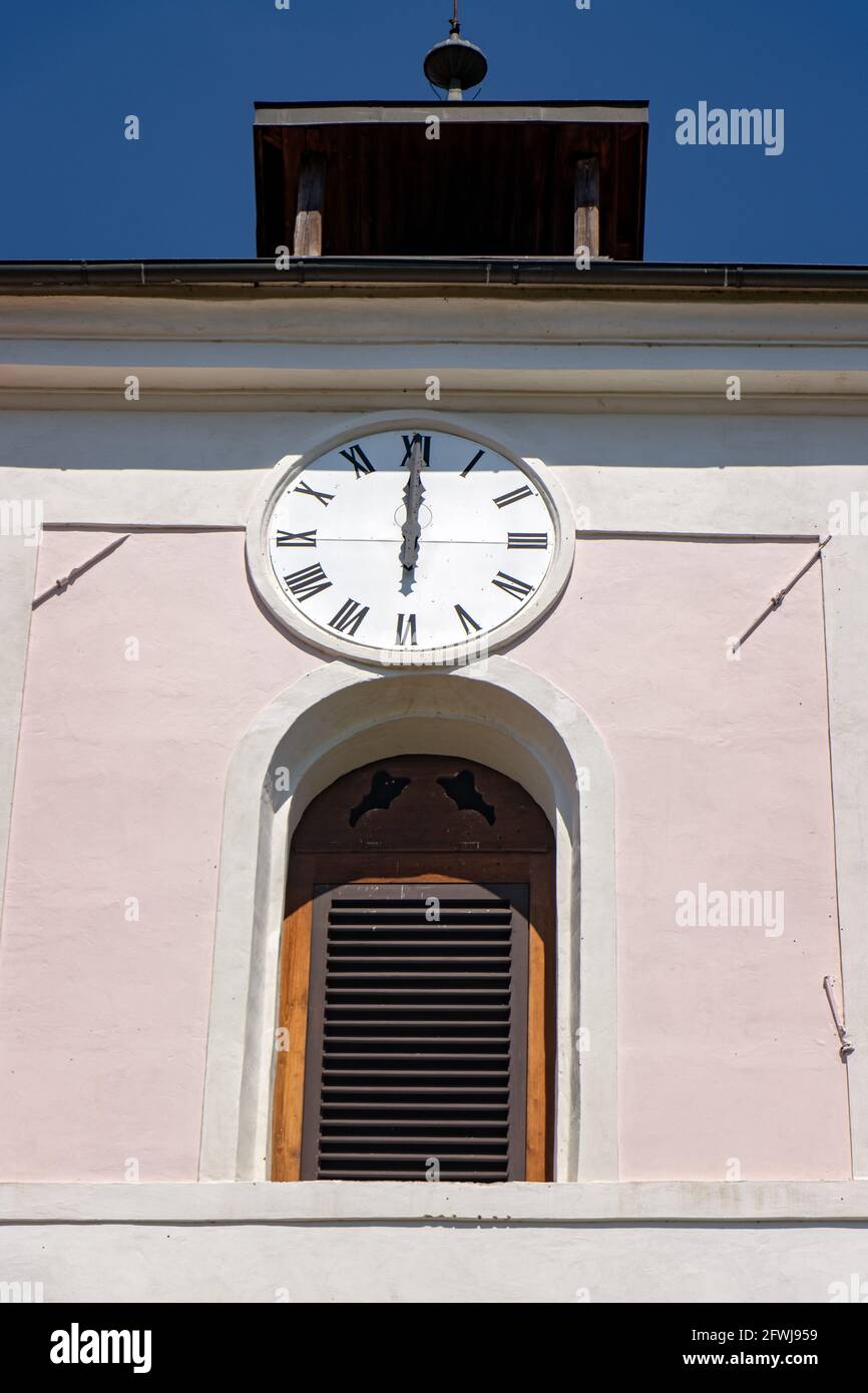 The church clock shows exactly twelve o'clock Stock Photo Alamy