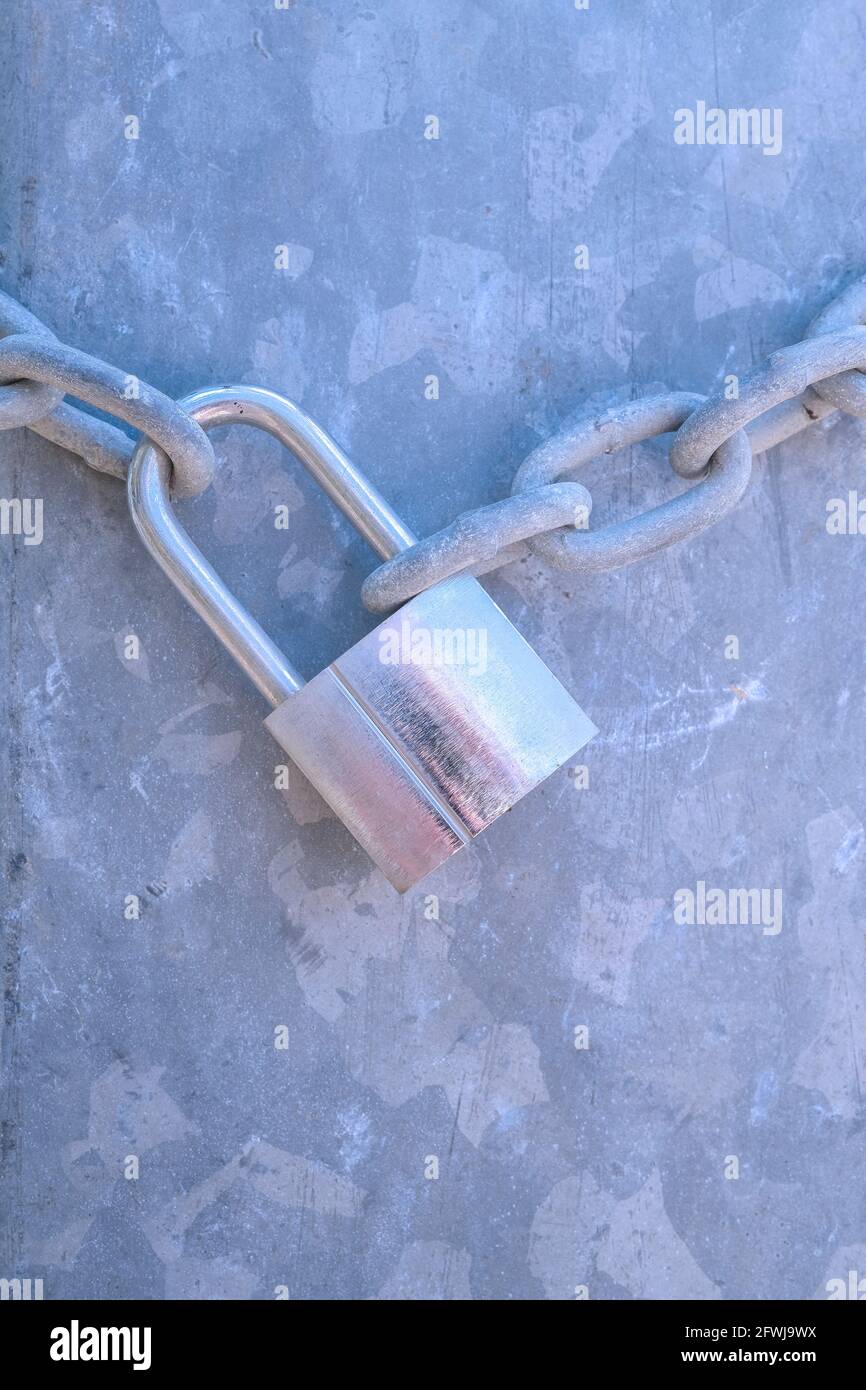 Stainless steel padlock with chain against metallic background Stock ...