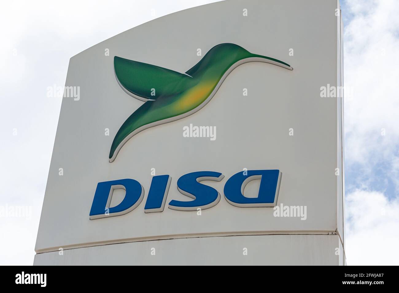 SPAIN, Tenerife - April 18, 2021: logo and name of the Spanish company of the gas station network DISA. Stock Photo Stock Photo