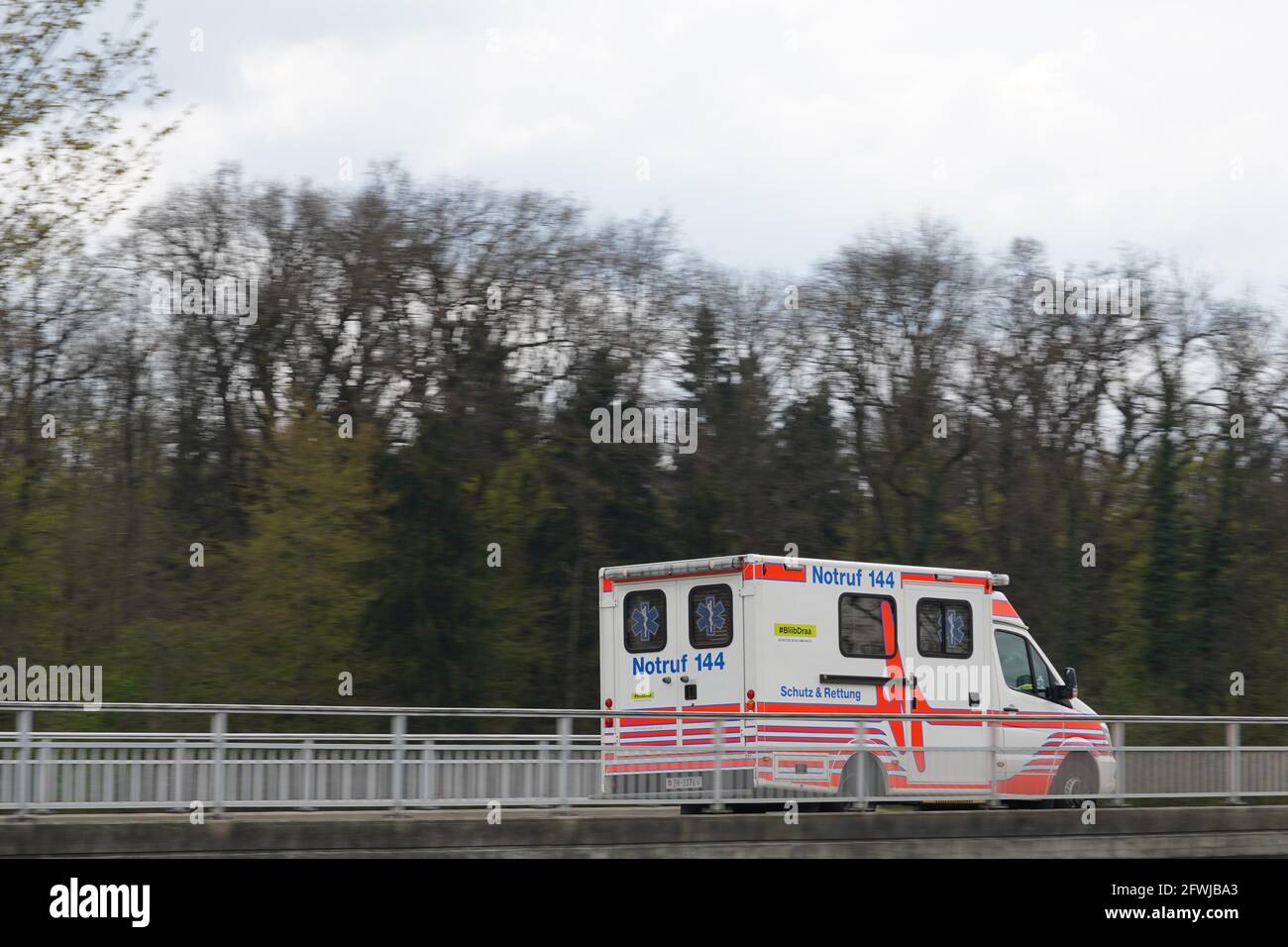 Swiss ambulance car driving to the hospital Stock Photo Alamy