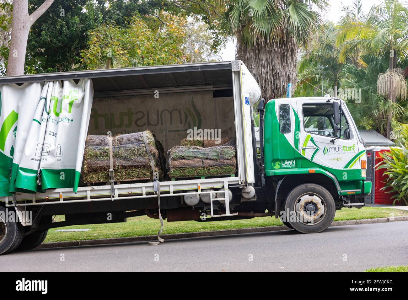 Australia, lawn solutions lorry delivering tiftuf Bermuda couch grass