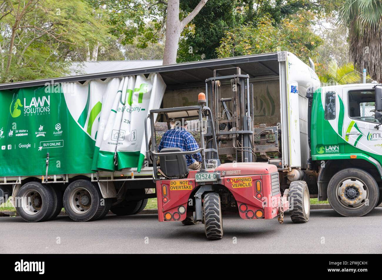 Australia, lawn solutions lorry delivering tiftuf Bermuda couch grass