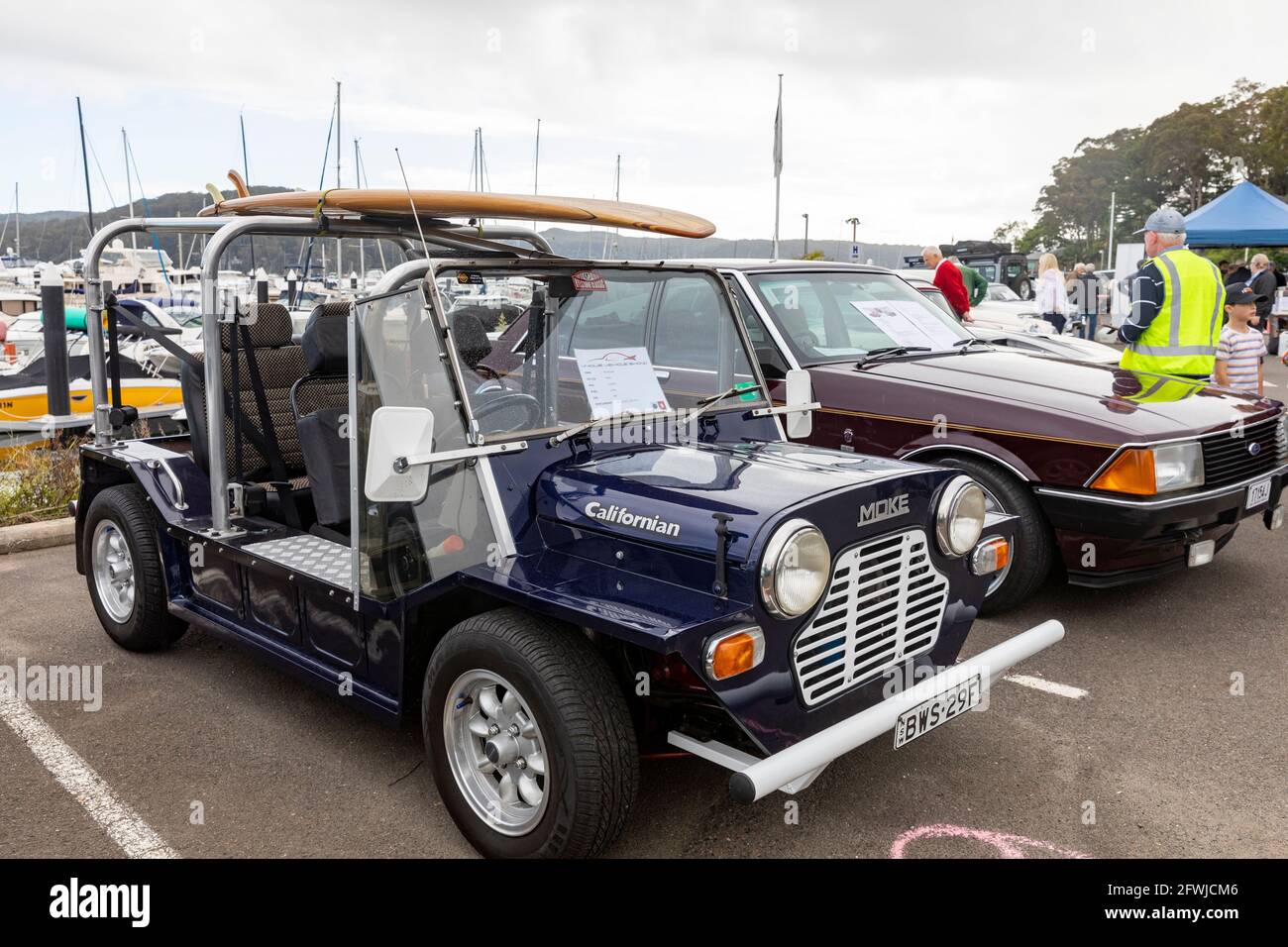 1981 British leyland Mini moke californian with surfboard on the roof at an Australian classic car show in Sydney Stock Photo