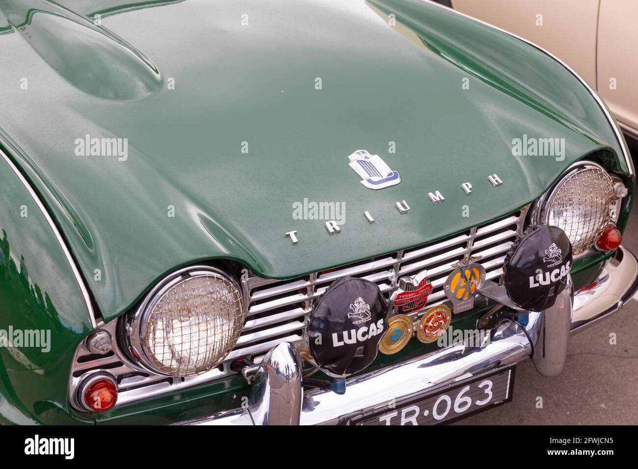 British racing green classic Triumph TR4 sports car close up of car front and bonnet grille,Sydney,Australia Stock Photo