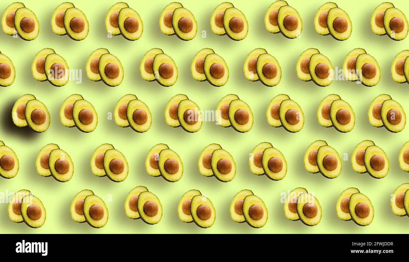 Top view of avocado pattern on green  background Stock Photo