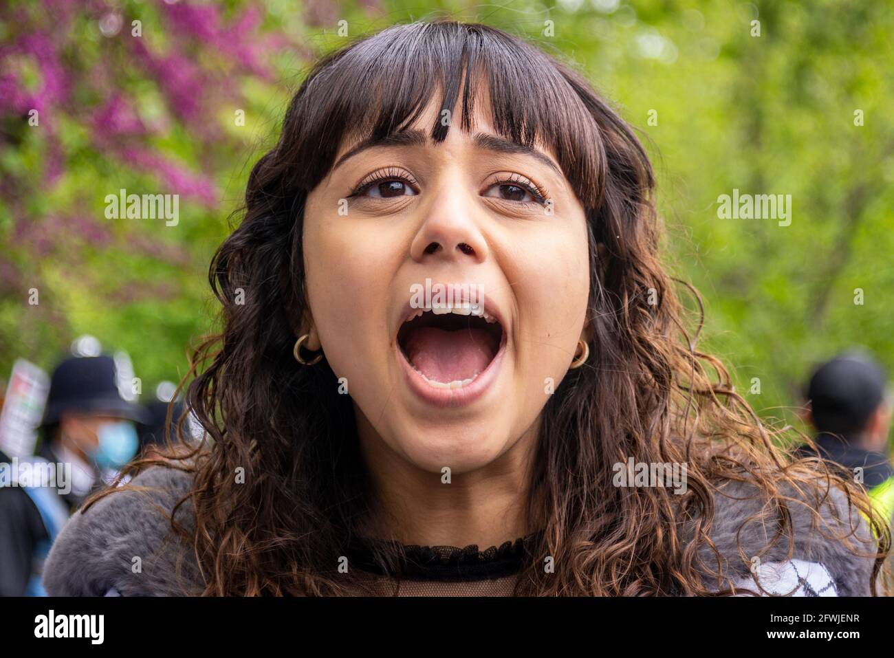 Protester at National Demonstration for Palestine, Free Palestine, in London, UK. Young female chanting Stock Photo