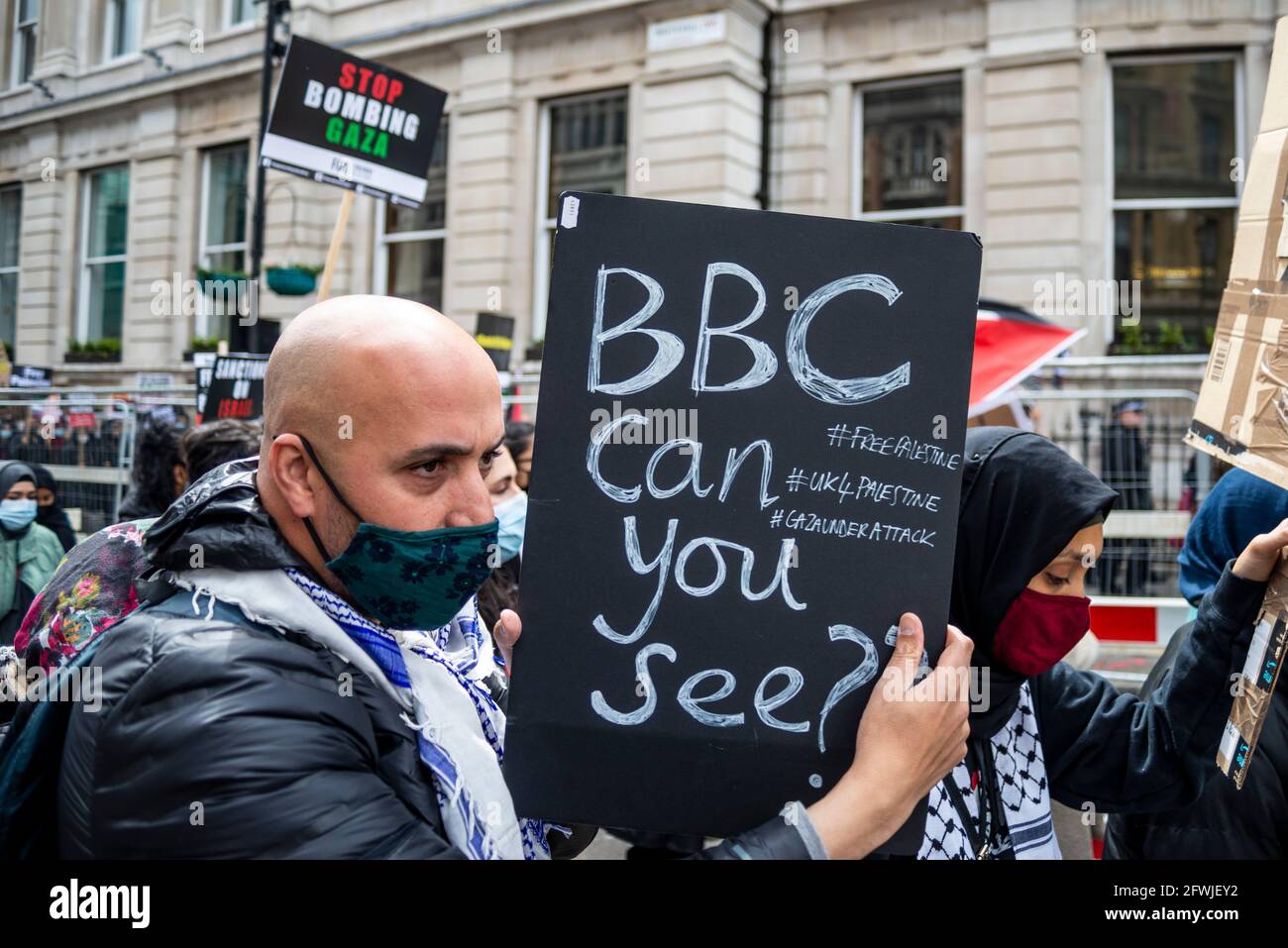 Protester at National Demonstration for Palestine, Free Palestine, in London, UK. Male with placard asking, BBC can you see. Complaint against media Stock Photo