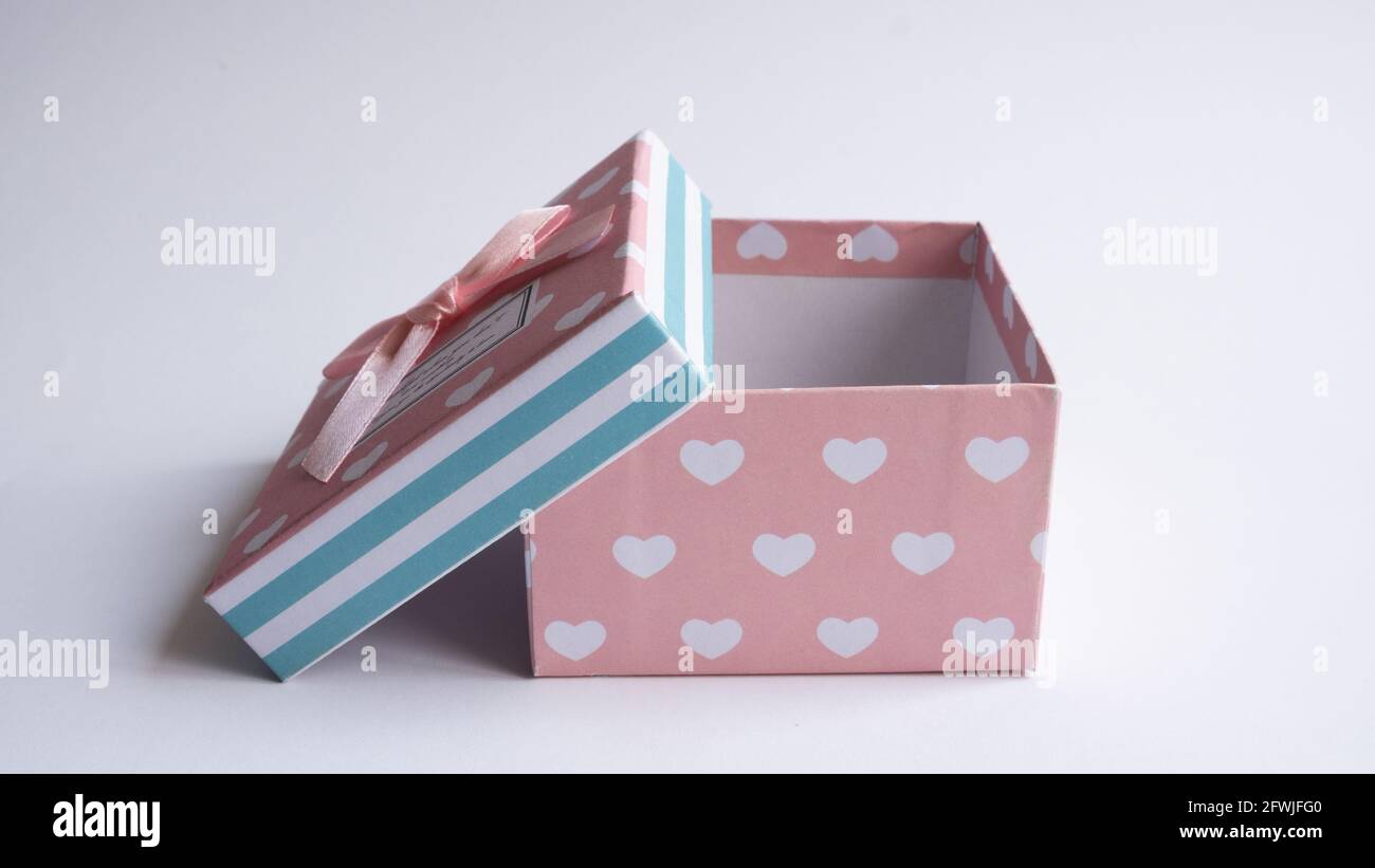 A multicolored gift box with an open lid. Empty gift boxes on white