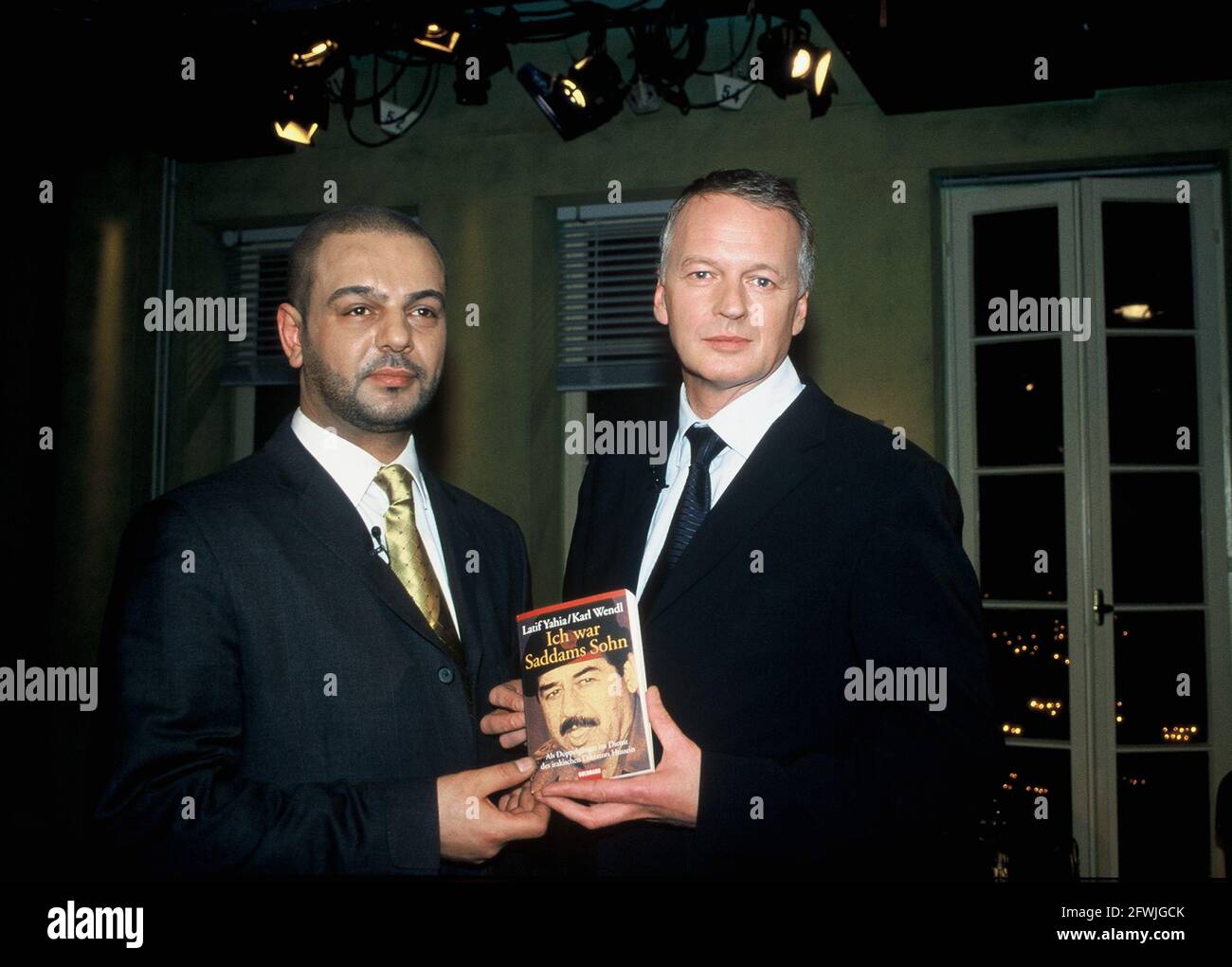 Cologne, Germany. 11th Feb, 2003. Latif YAHIA, from 1986 to 1991 FIDAL - double-ganger, bodyguard and body-owner - of UDAI HUSSEIN the eldest son of the Iraqi dictator Sadam Hussein Karl WENDL, editor-in-chief of NEWS, l-r, 11 February 2003 Photo : Horst Galuschka Credit: Horst Galuschka/dpa/Horst Galuschka dpa/Alamy Live News Stock Photo