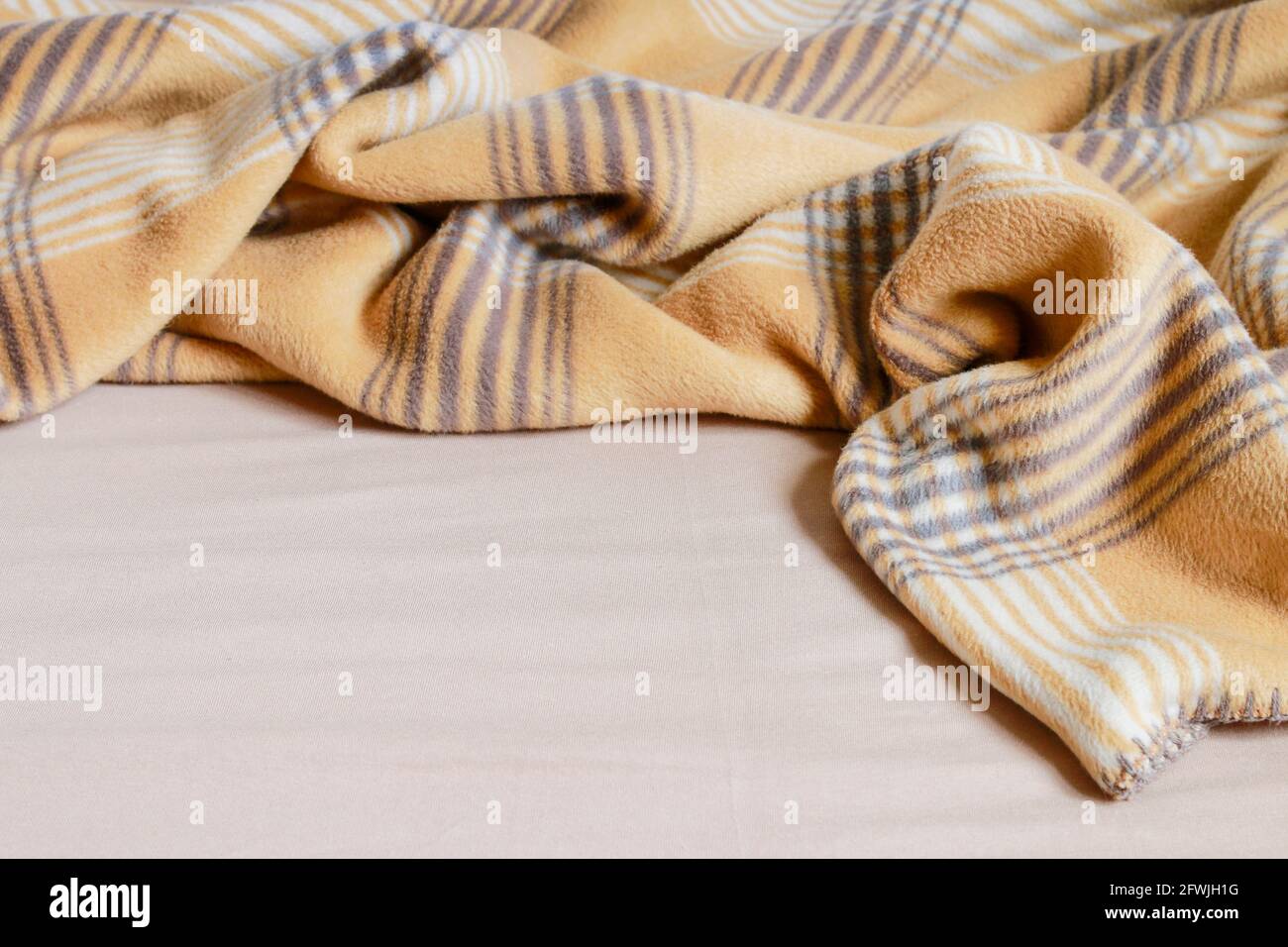 Beige blanket and bedsheet. Graphic resources Stock Photo