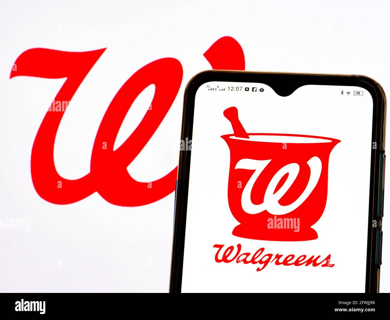 In this photo illustration Walgreen Company logo seen displayed on a