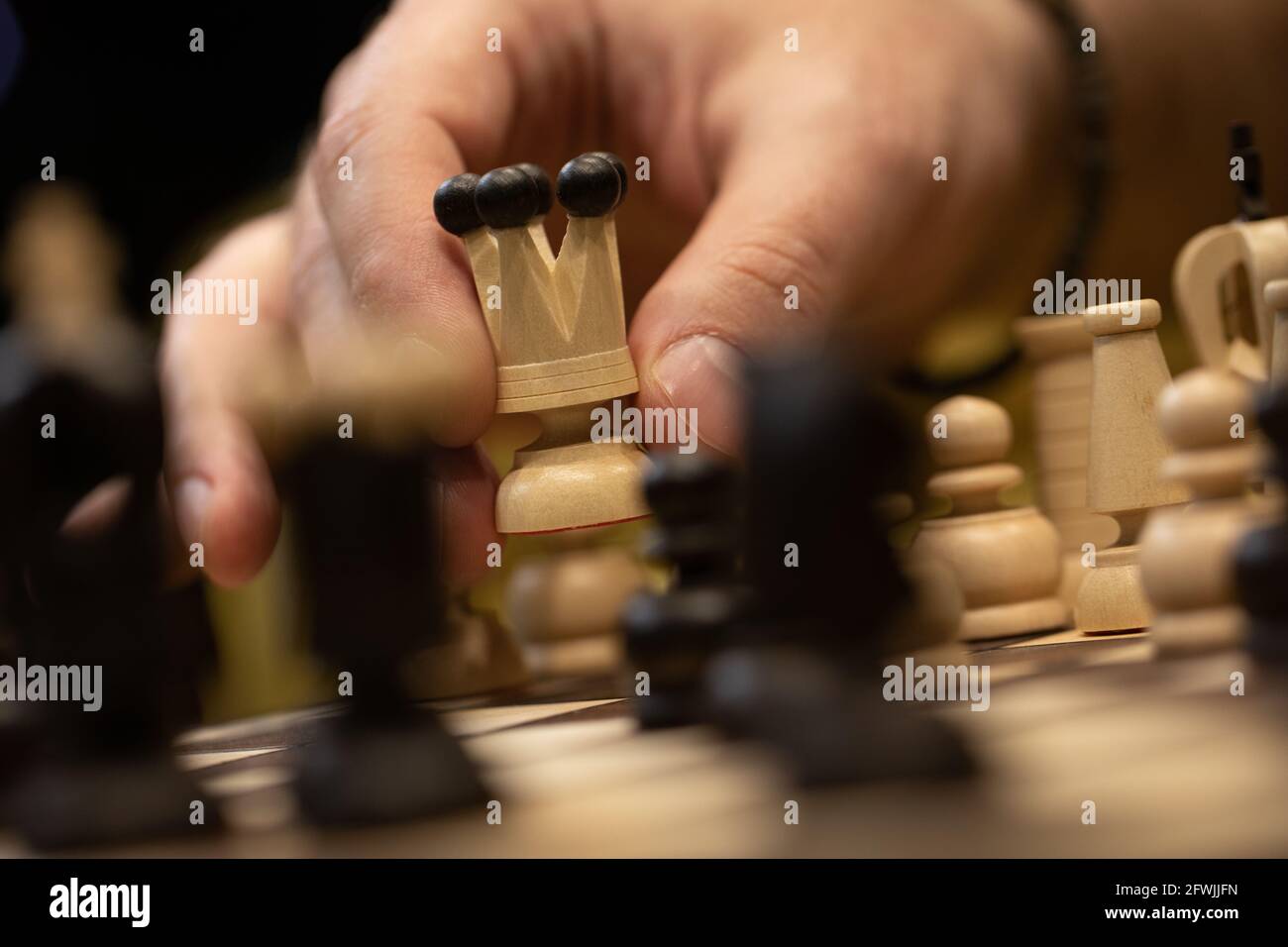 Hand moves queen piece on hi-res stock photography and images - Alamy