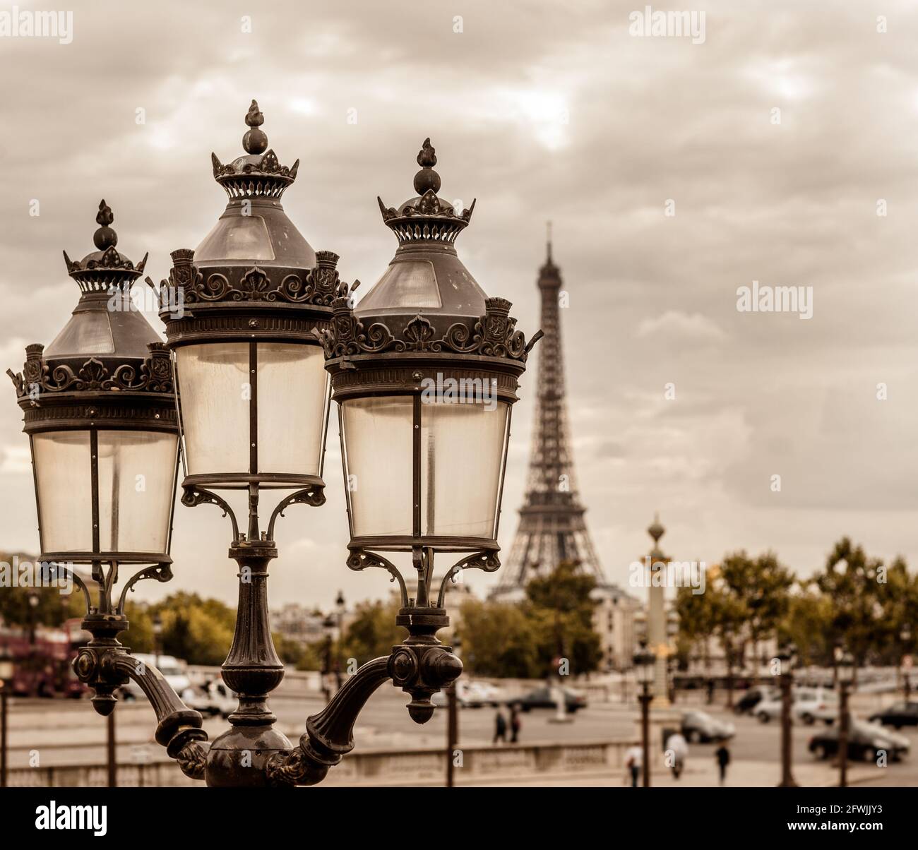 Paris cityscape with the iconic Eiffel tower lit by sun beams. (sepia rendition). (sepia rendition) Stock Photo