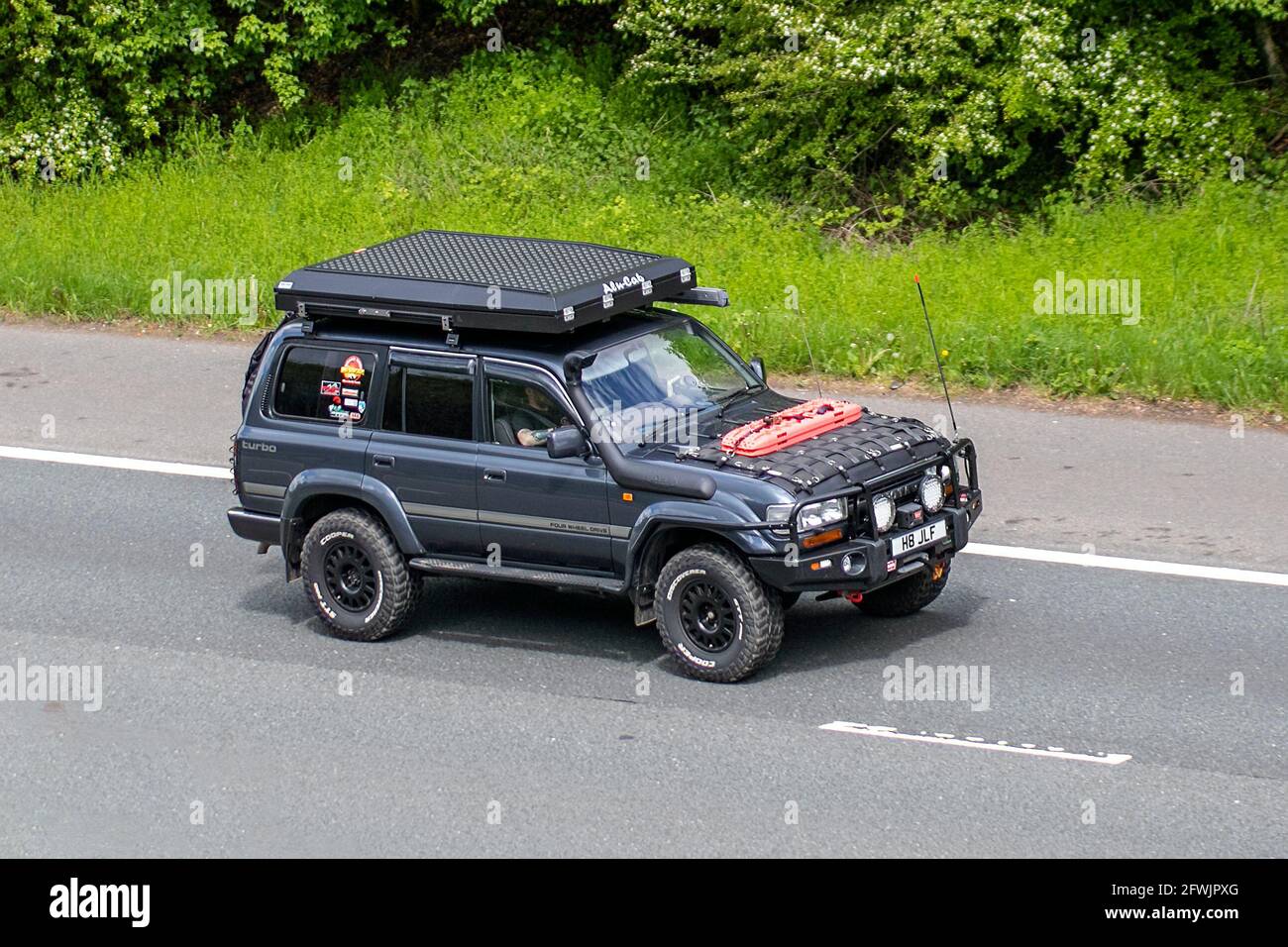 1992 1990s Toyota Land Cruiser Vx Auto; Vehicular traffic, moving vehicles, cars, vehicle driving on UK roads, motors, motoring on the M6 motorway highway UK road network. Stock Photo