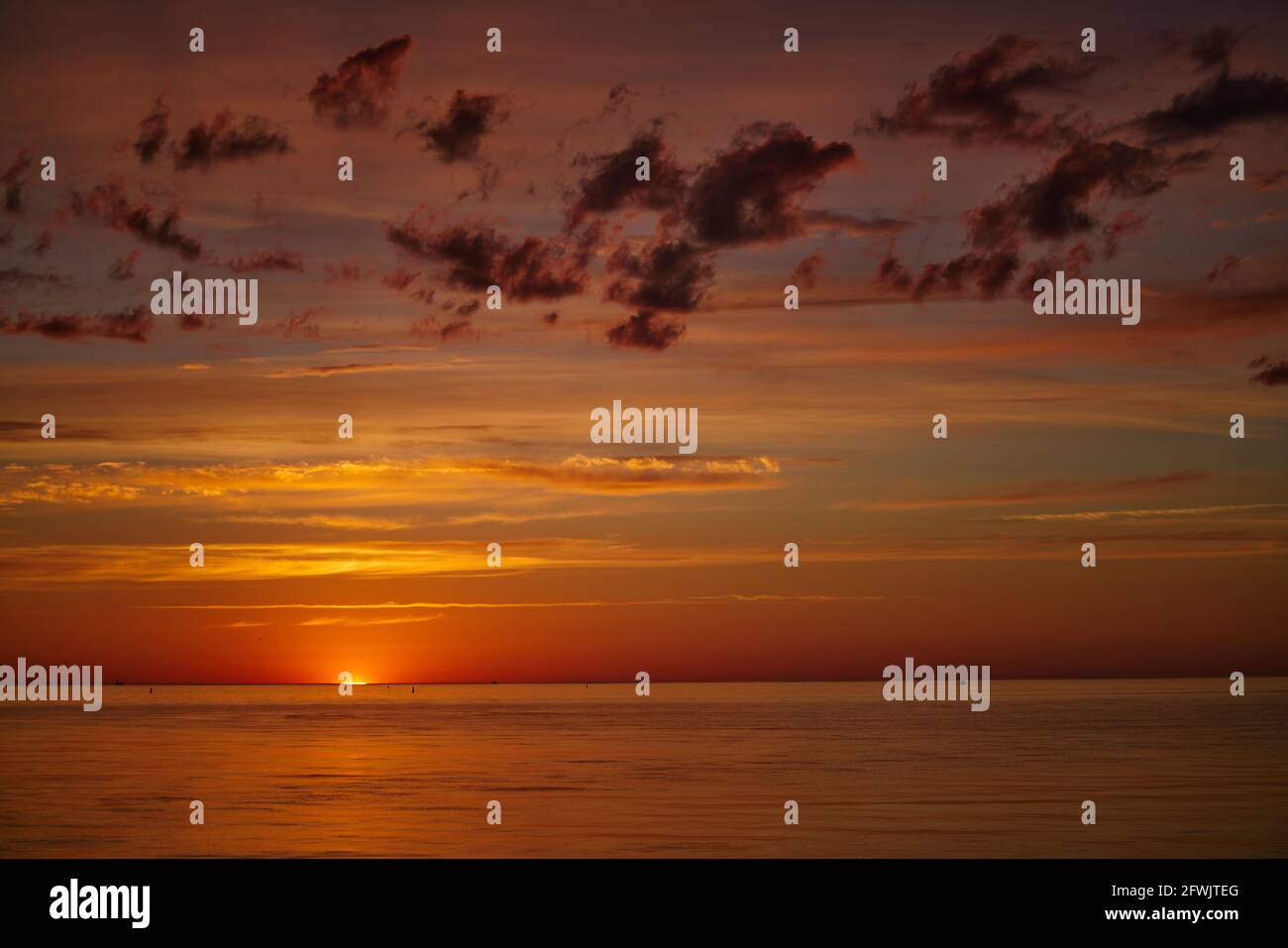 Dramatic sunset sky with clouds. Dramatic sunset over the sea Stock ...