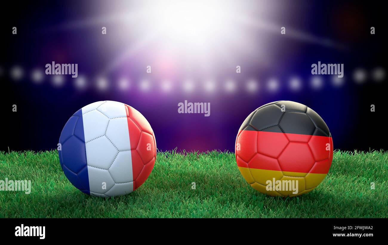 Two soccer balls in flags colors on stadium blurred background. France