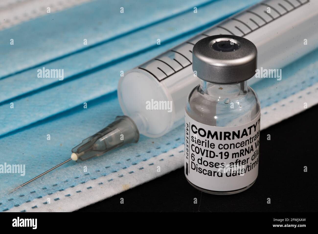 An ampoule of comirnaty vaccine. Isolated. High quality photo. Cl;ose up Stock Photo