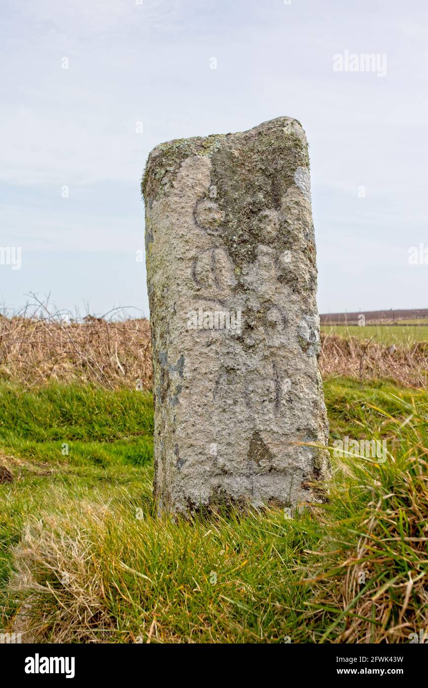 Ancient lettering inscribed on this standing stone in west Cornwall, England, UK. Stock Photo
