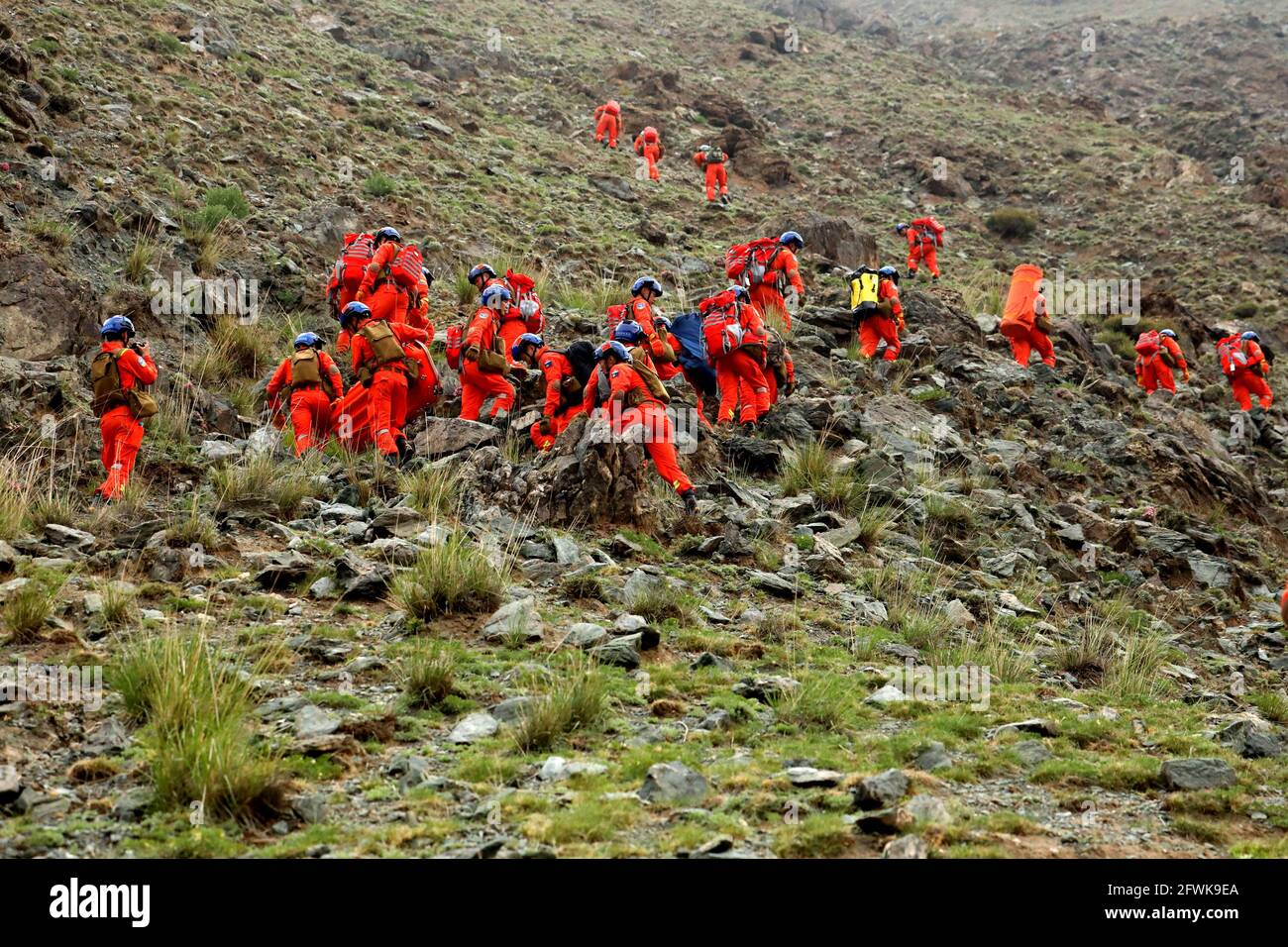 Jingtai County of Baiyin City, northwest China's Gansu Province, May 23, 2021.Rescuers search for victims in Jingtai County of Baiyin City, northwest China's Gansu Province, May 23, 2021. Lasting almost 24 hours, rescue work came to an end after extreme weather killed 21 during a 100-km cross-country mountain marathon race in Baiyin City, northwest China's Gansu Province, the local rescue headquarters said on Sunday. (Fire and Rescue Department of Gansu/Handout via Xinhua) Stock Photo