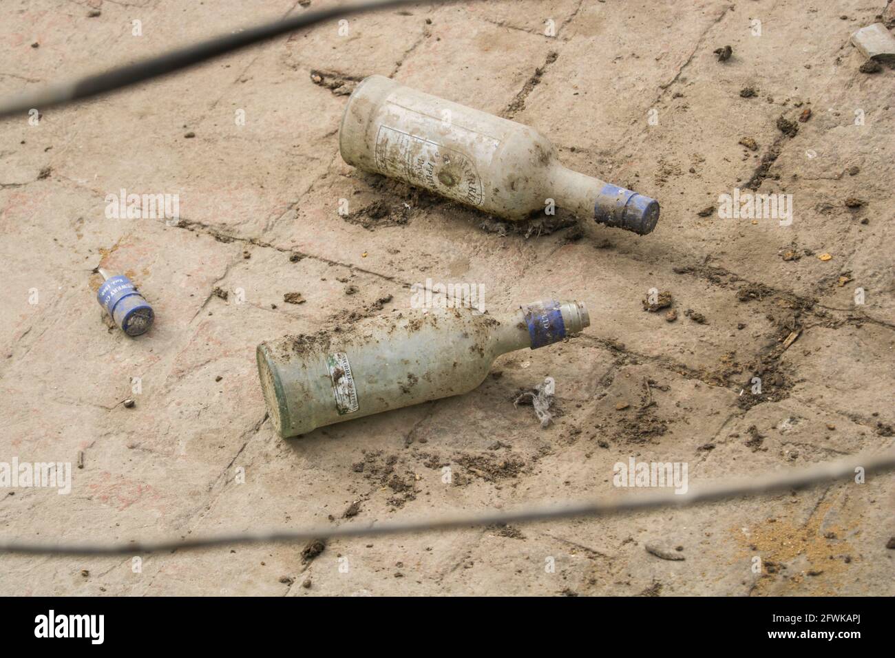 Lahore Punjab, Pakistan - April 14, 2021: Empty glass bottles of Alcohol, Dirty bottles of wine. Stock Photo