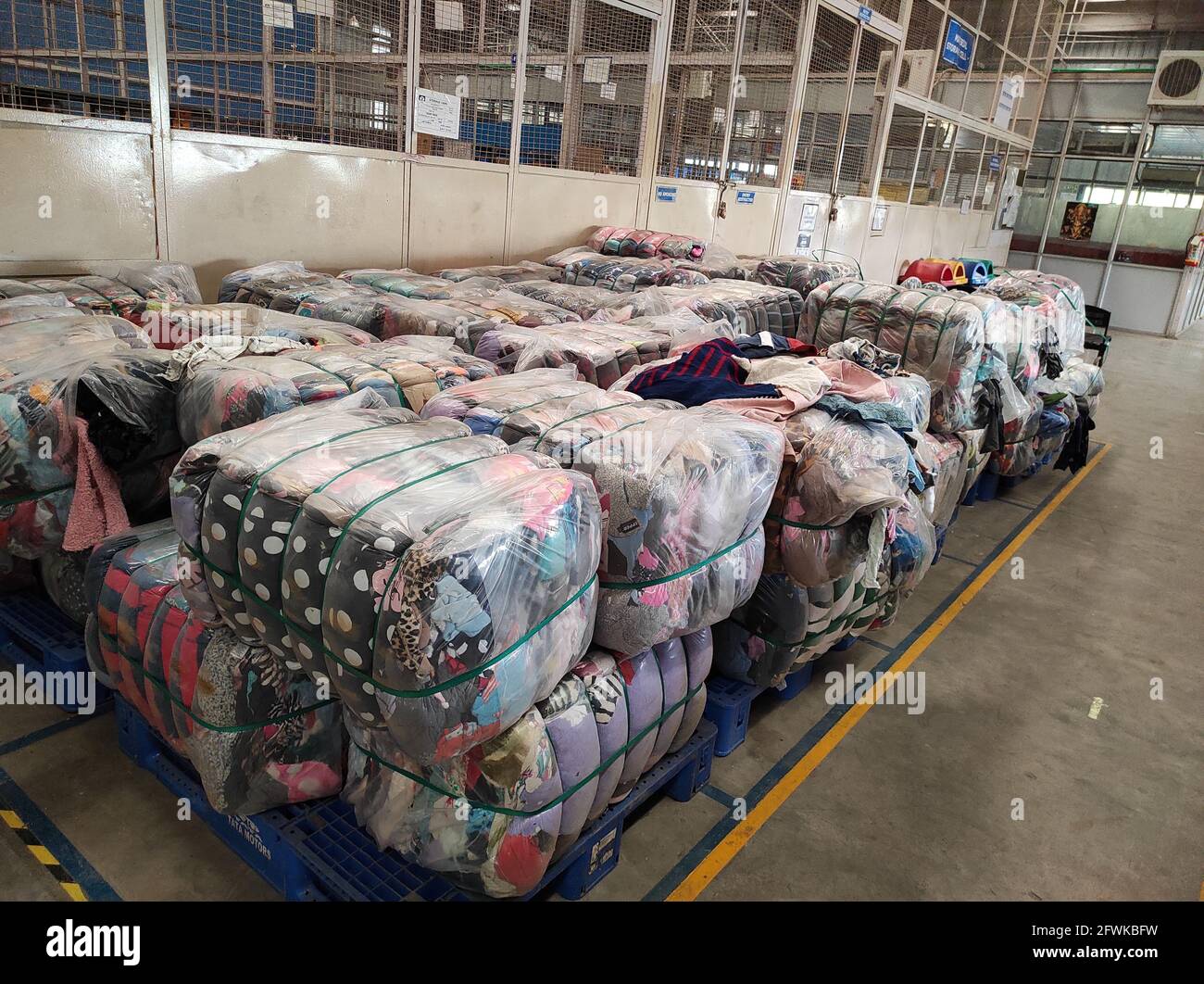 A closeup of assorted secondhand clothes in the warehouse Stock Photo