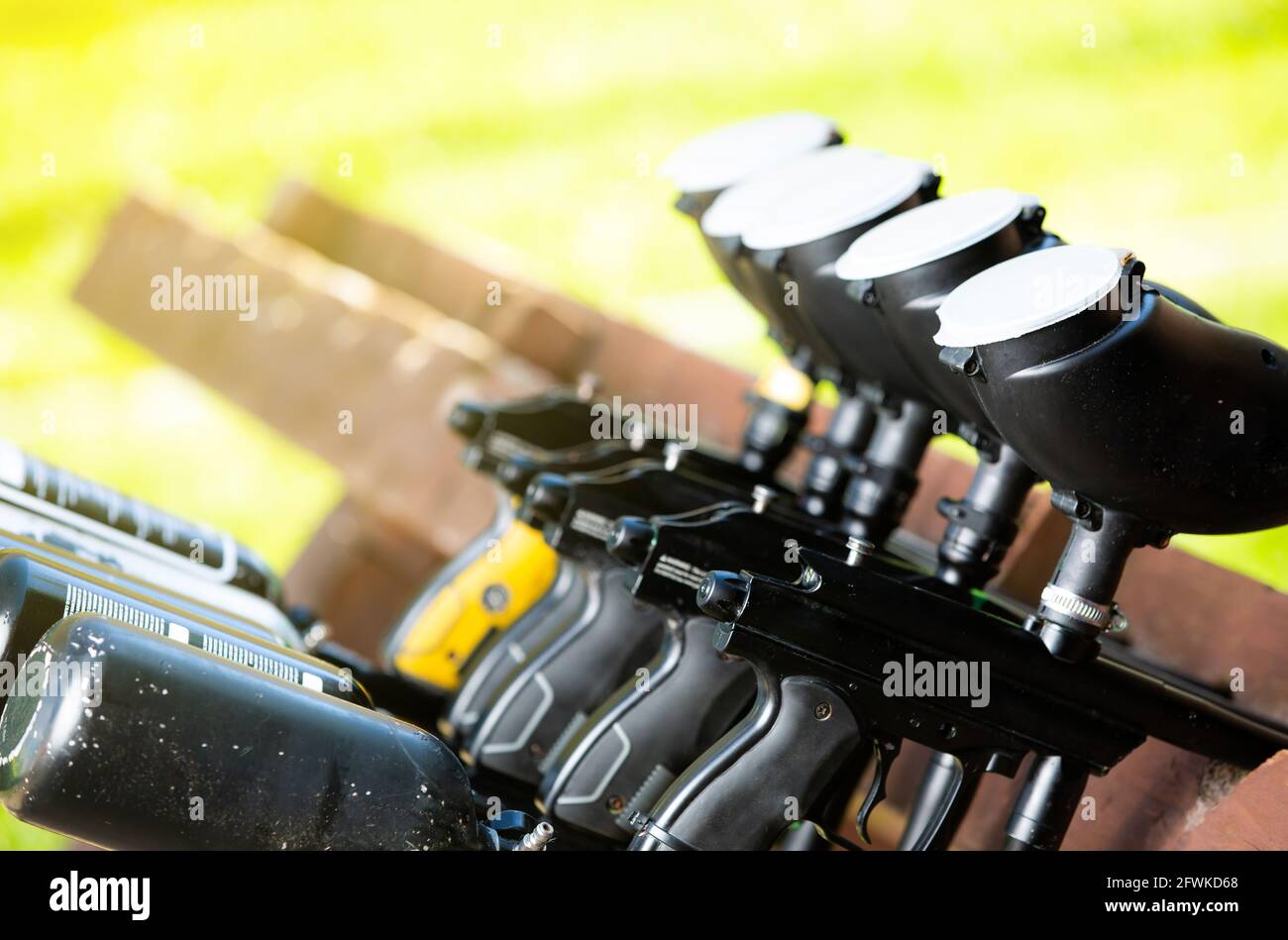 Close up of a professional paintball guns in a row, prepared for an