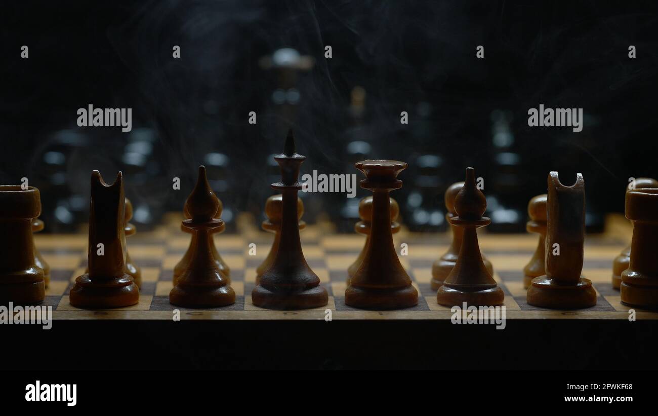 Illuminated chess with smoke effect. Suitable for commercials. Stock Photo