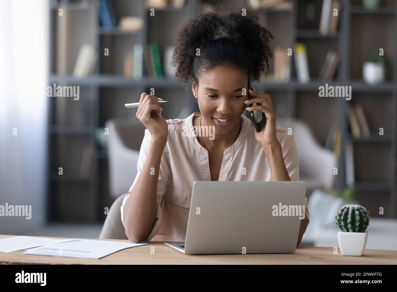 Beautiful african businesswoman smiling hi-res stock photography and ...