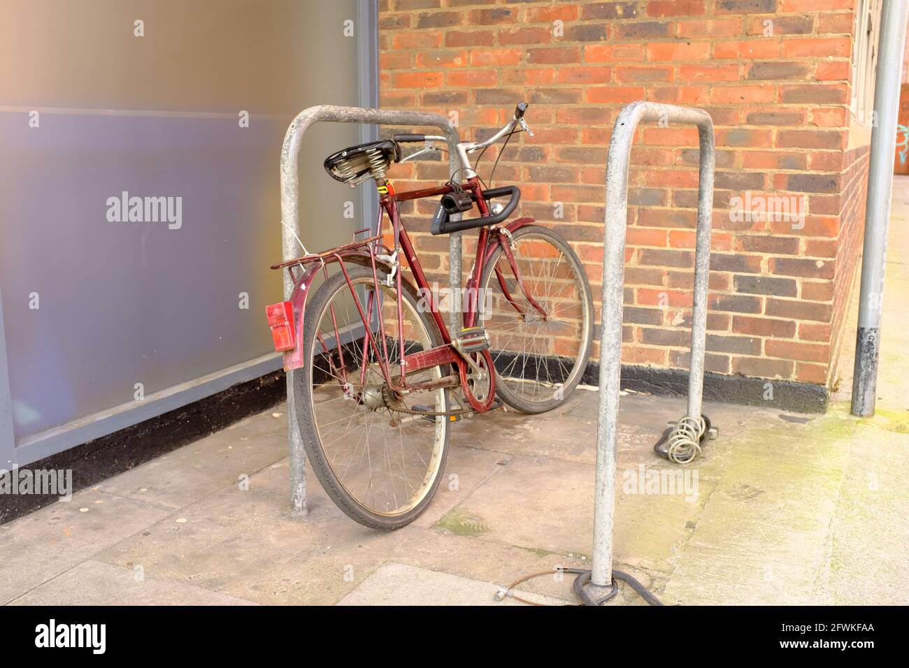 May 2021 - Traditional bike left securely in a Bristol, England, UK Stock Photo