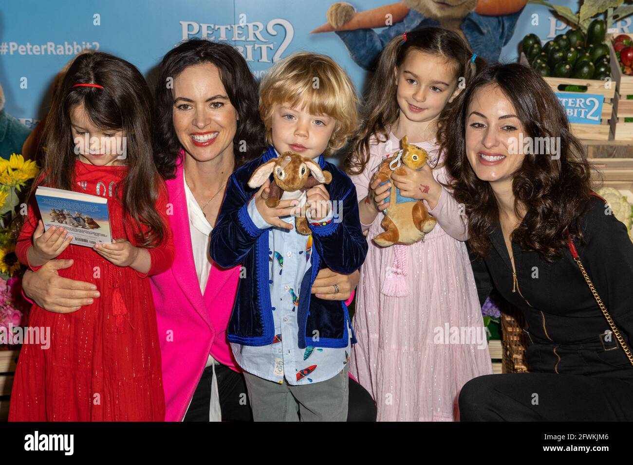 London, UK. 23rd May, 2021. Sally Wood with Daughters Grace and Alice and Melanie Hamrick with Son Deveraux attend the UK Gala Screening of 'Peter Rabbit 2: The Runaway' at Picturehouse Central in Piccadilly. Credit: SOPA Images Limited/Alamy Live News Stock Photo
