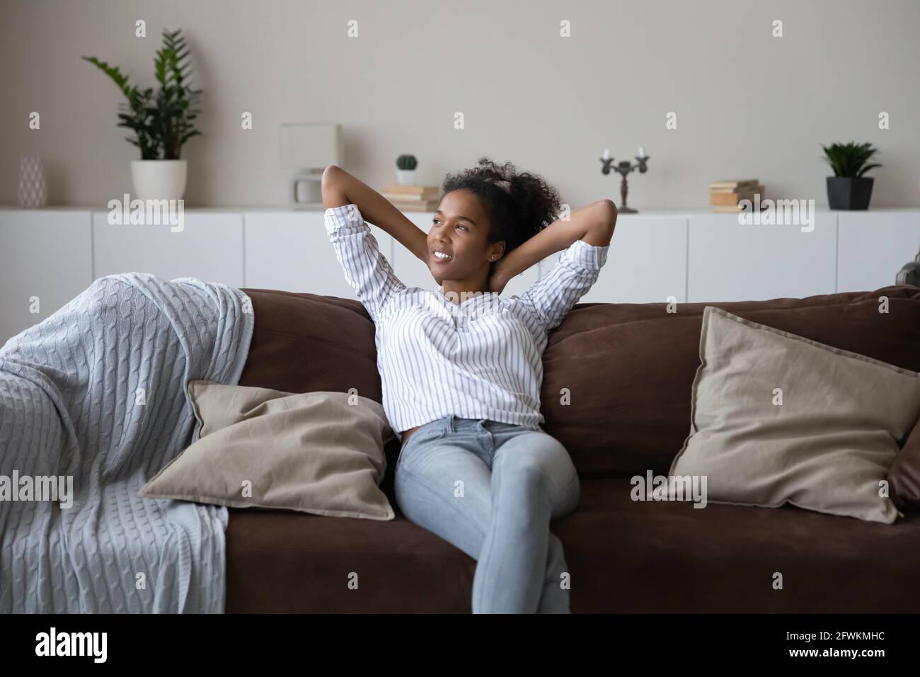 African american sitting on sofa hi-res stock photography and images ...