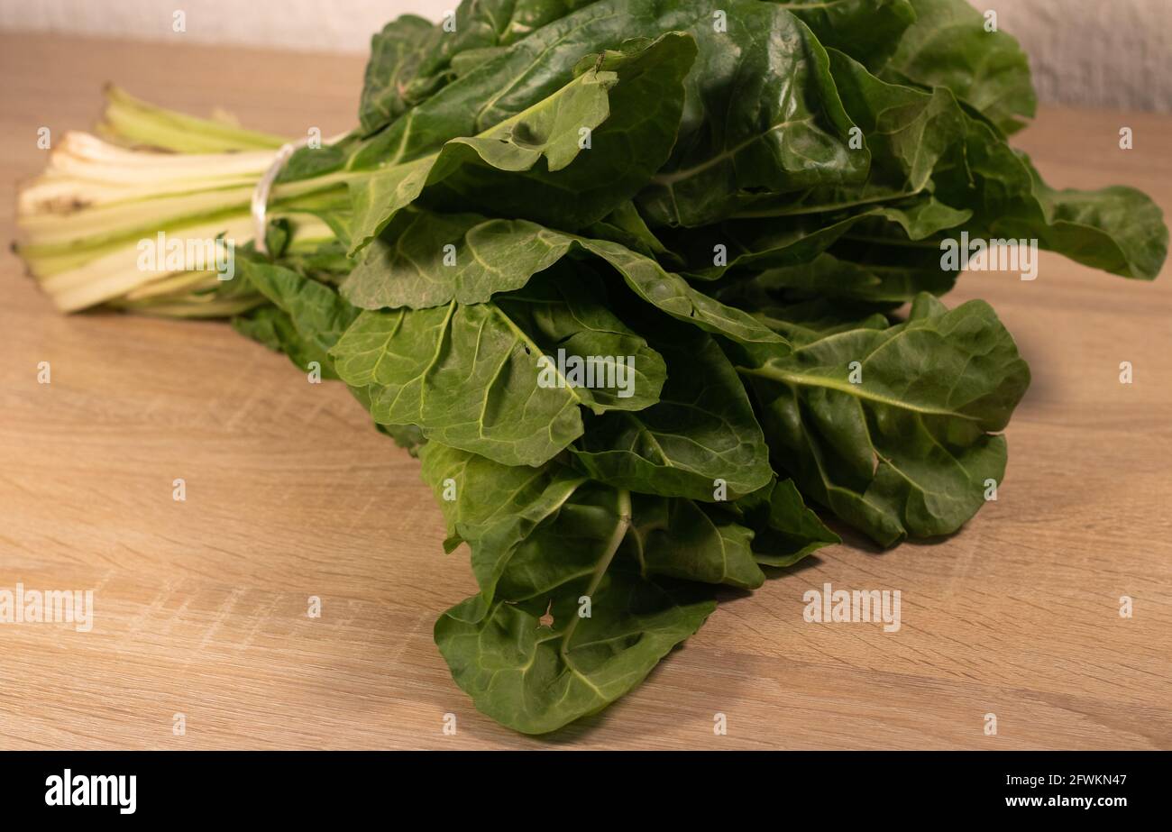 Buch of green chard leaf. Buch of swiss chard. Green leafs. Green leafy vegetable. Beta vulgaris var. cicla Stock Photo