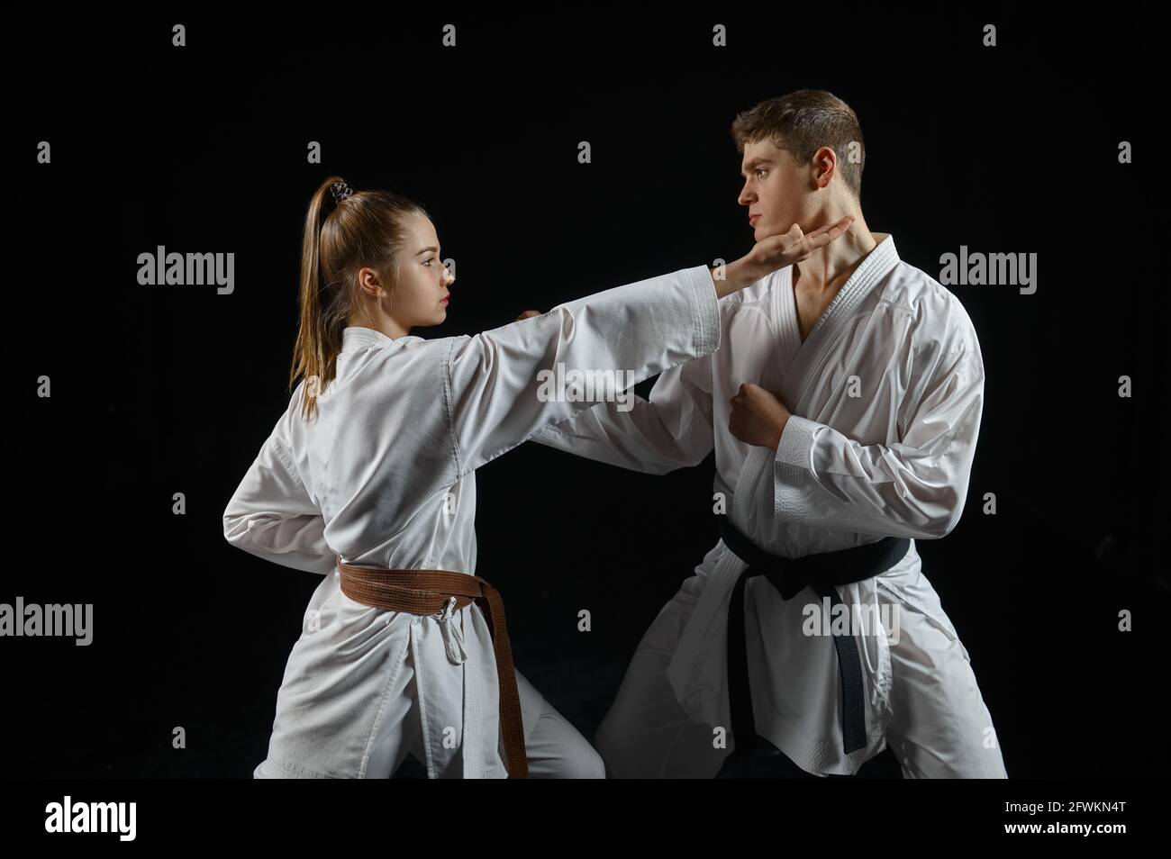 Female karate fighter on training with master Stock Photo