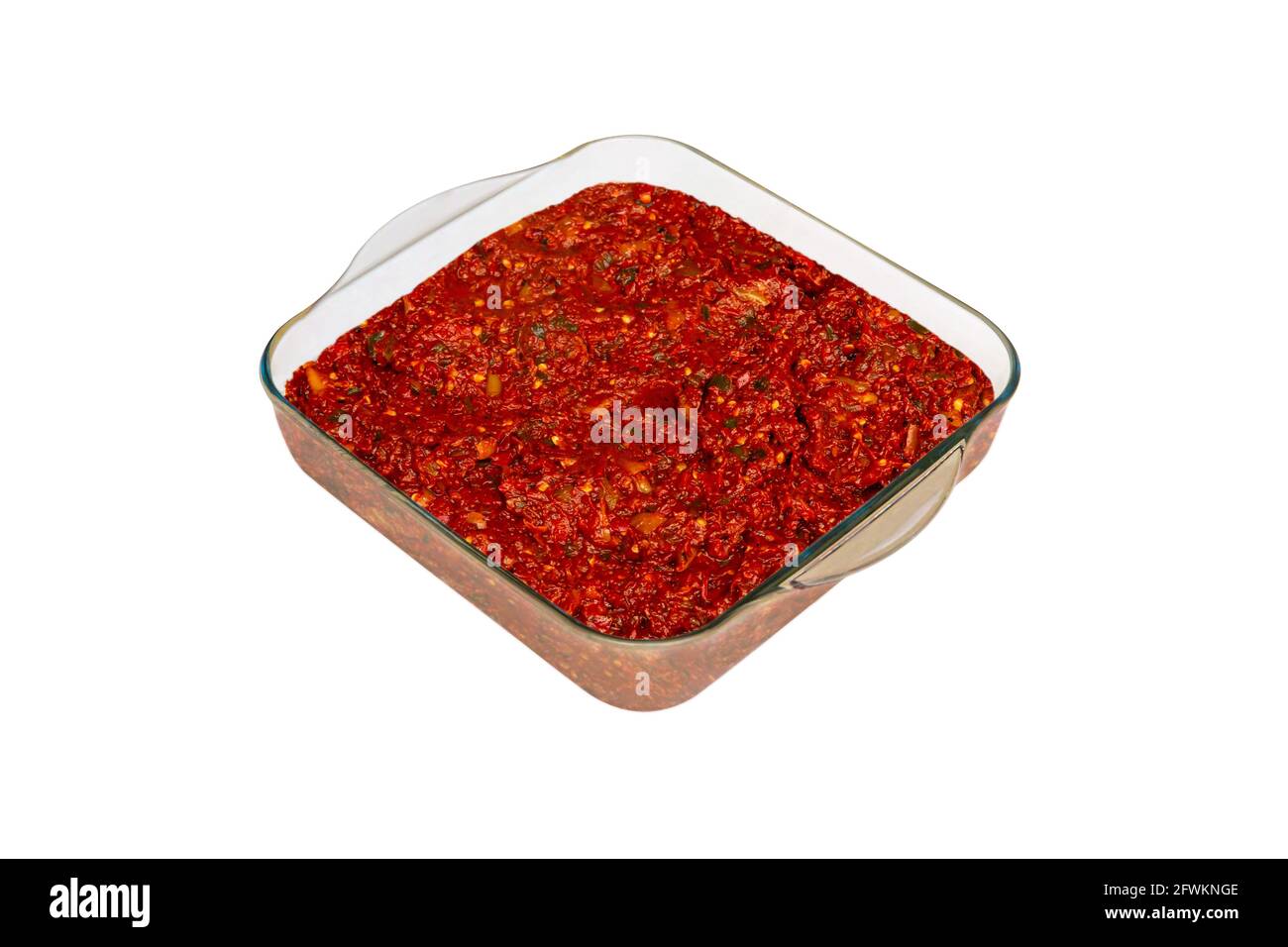 Traditional appetizer dishes "Acili Ezme" in a glass plate. Top view