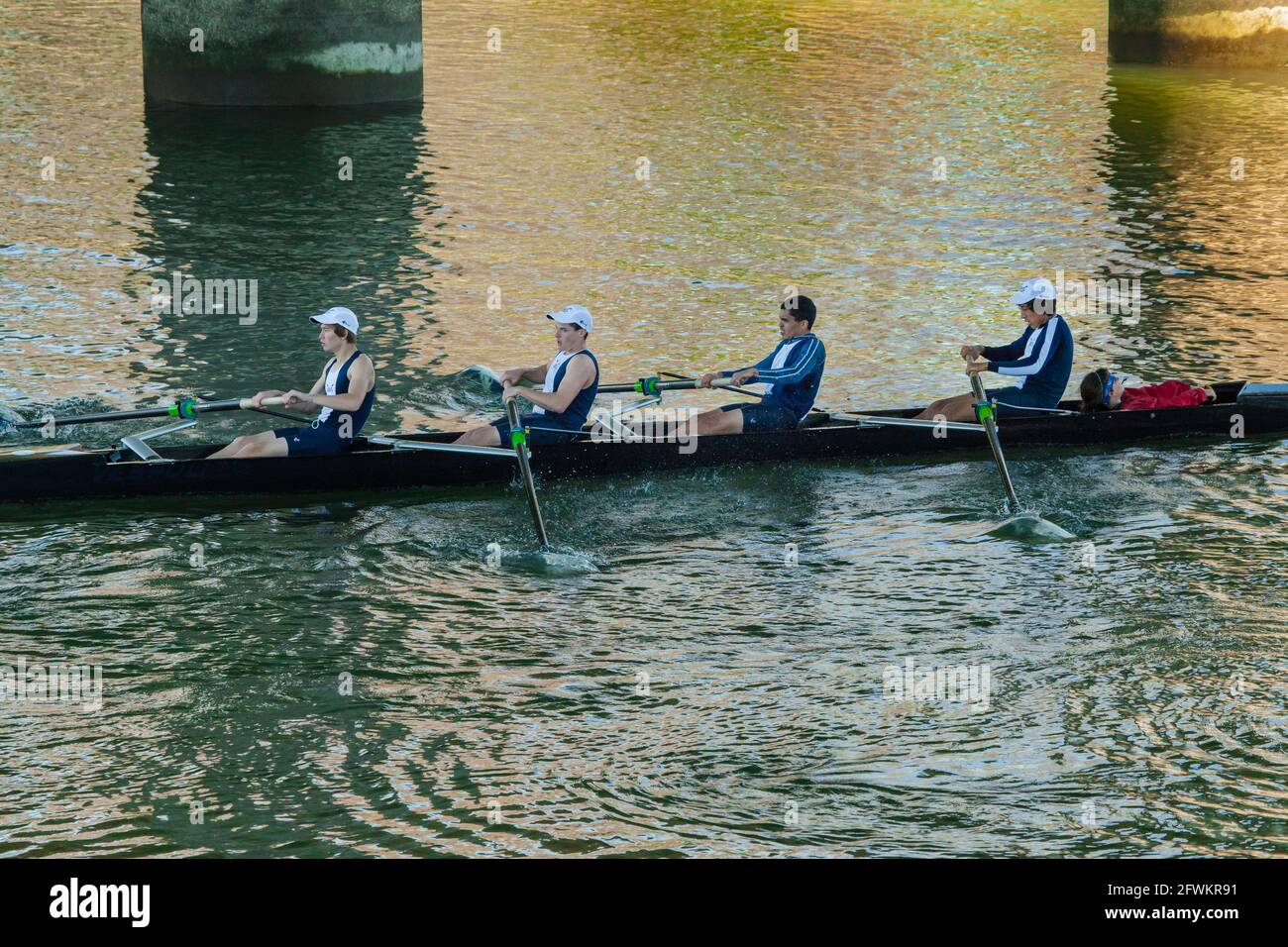 Young men's coxed quad in early morning regatta at Port of Sacramento, CA. Stock Photo