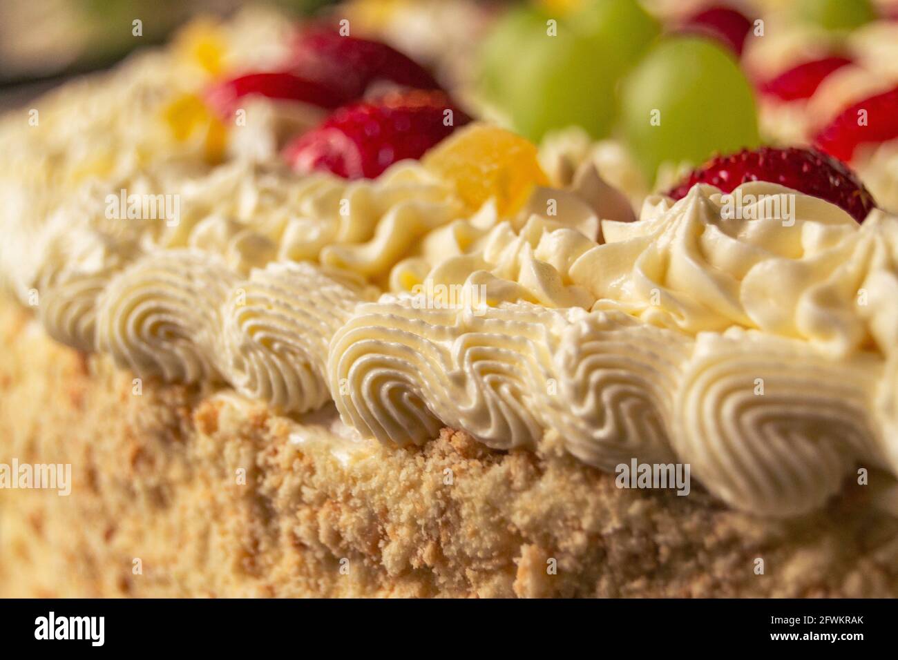 Macro shot of a buttercream cake with fruits on the top Stock Photo Alamy