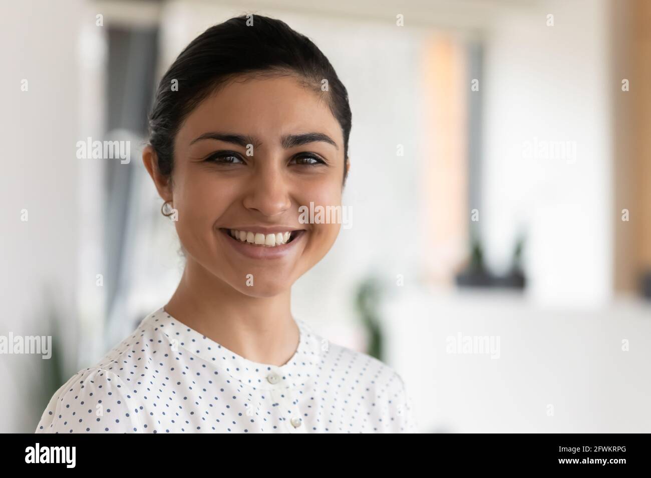 Head shot portrait of confident successful smiling Indian businesswoman Stock Photo