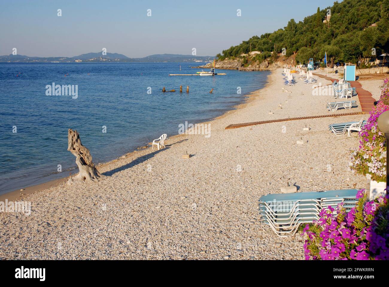 Early morning on an empty beach, Nissaki, Corfu, Greece Stock Photo